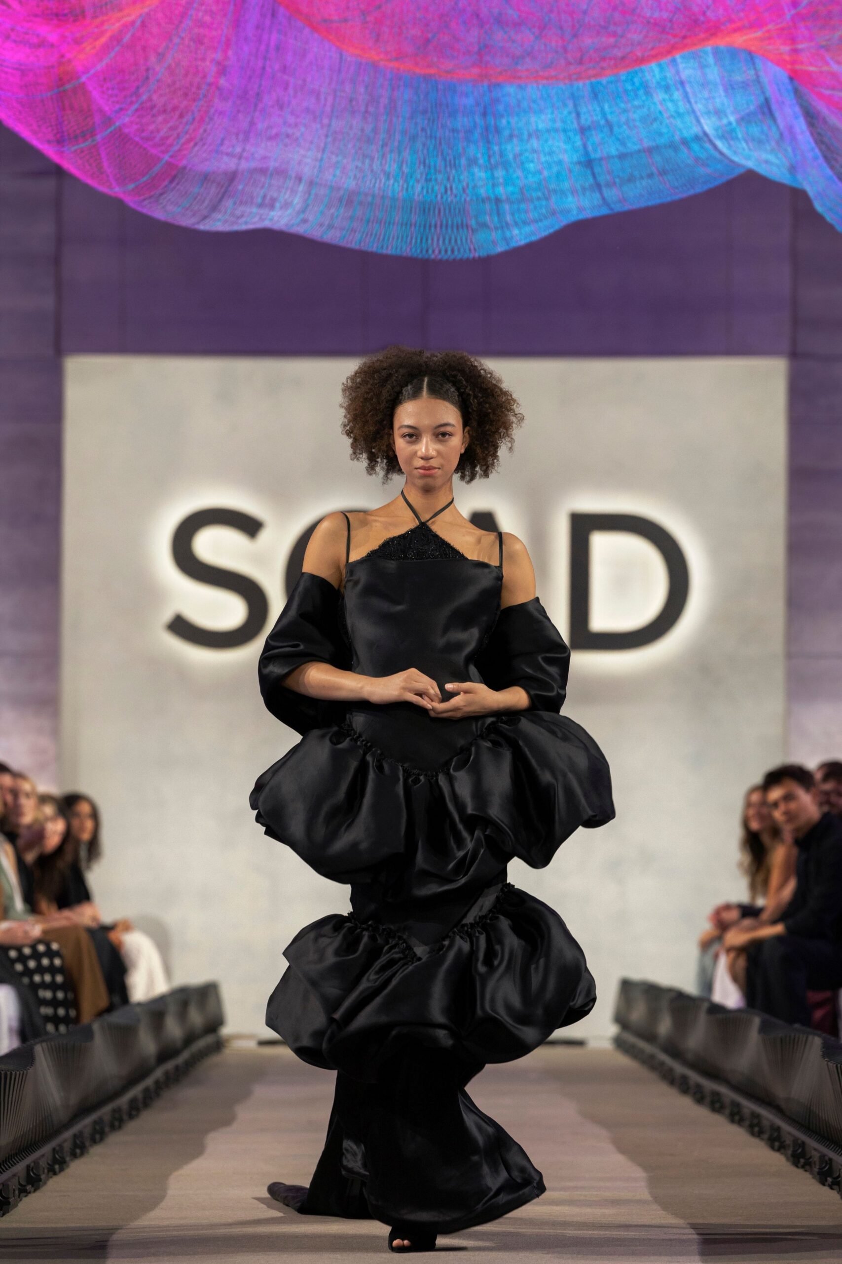 black silk off-shoulder gown