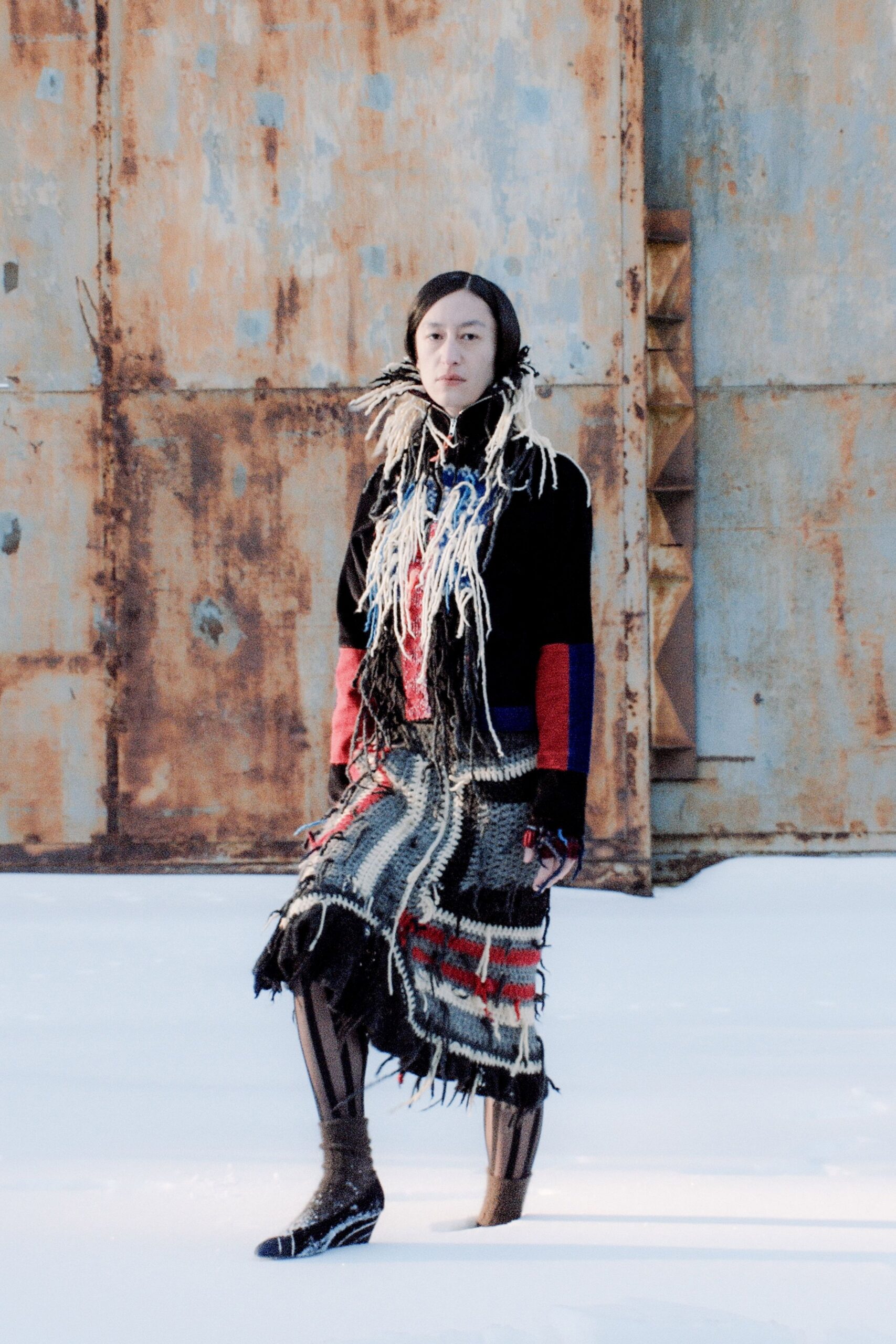 black wool sweater with fringed skirt