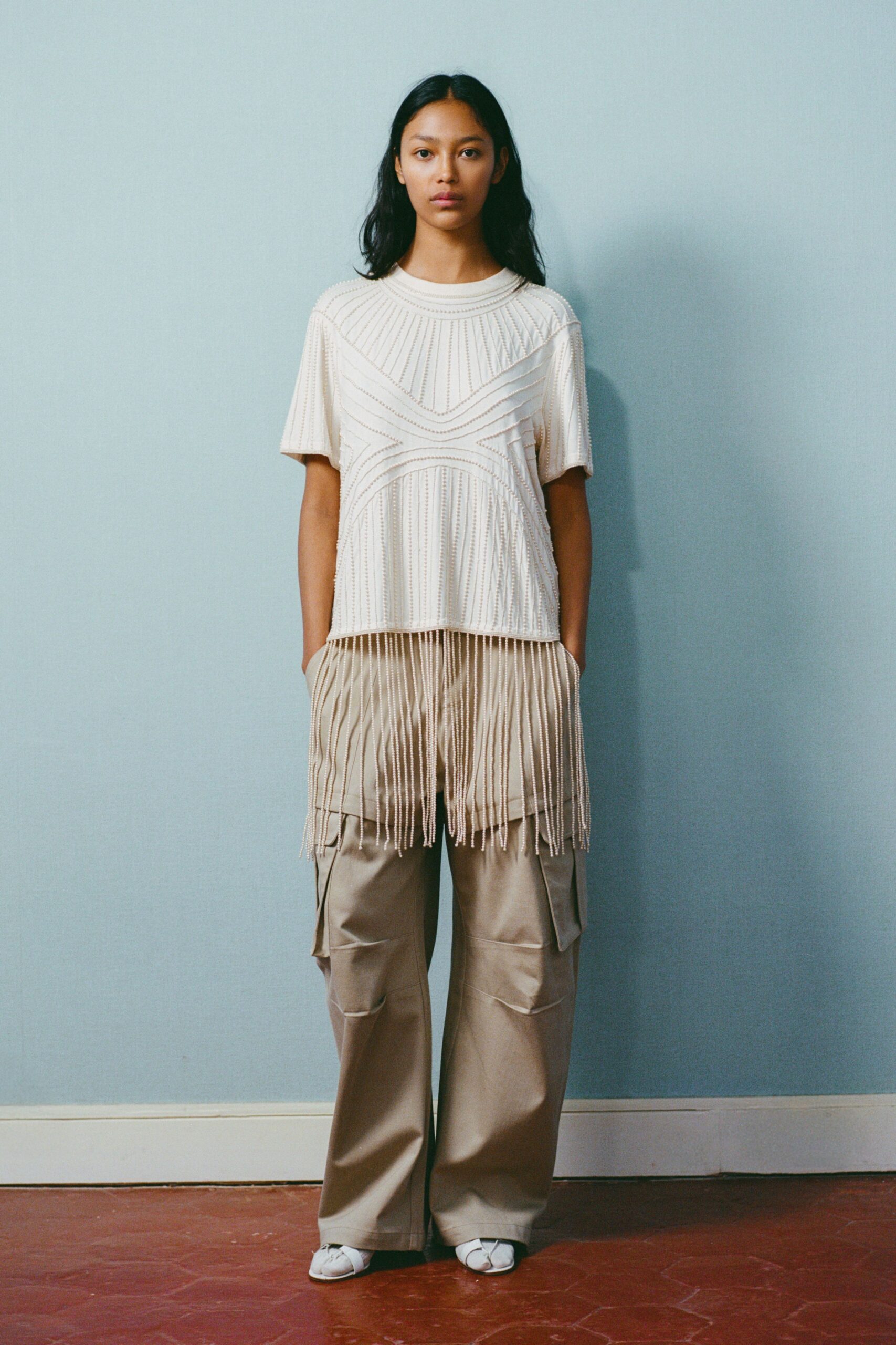 beige fringed top with cargo pants