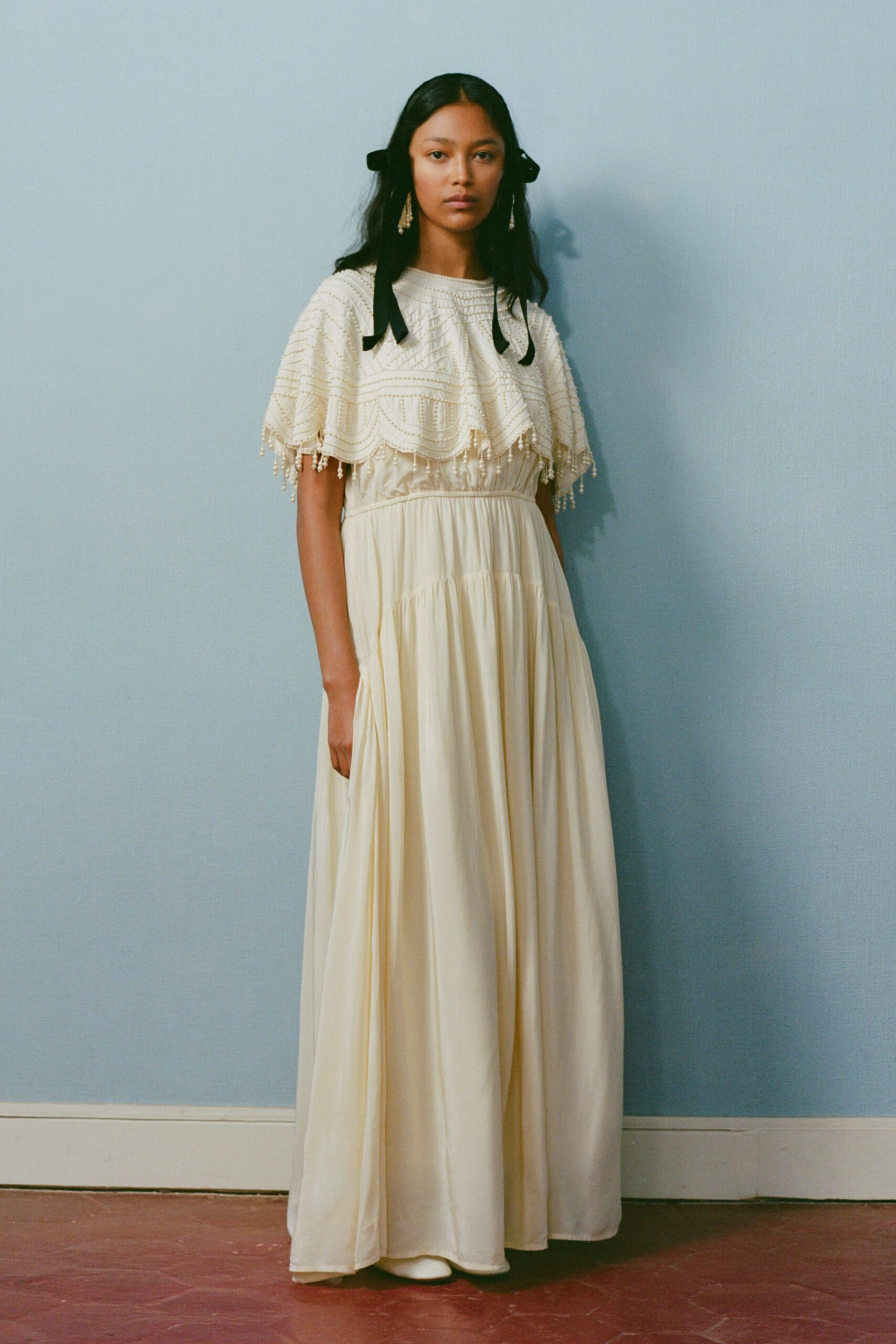 ivory cotton sleeveless high-neck relaxed pleated layered gown