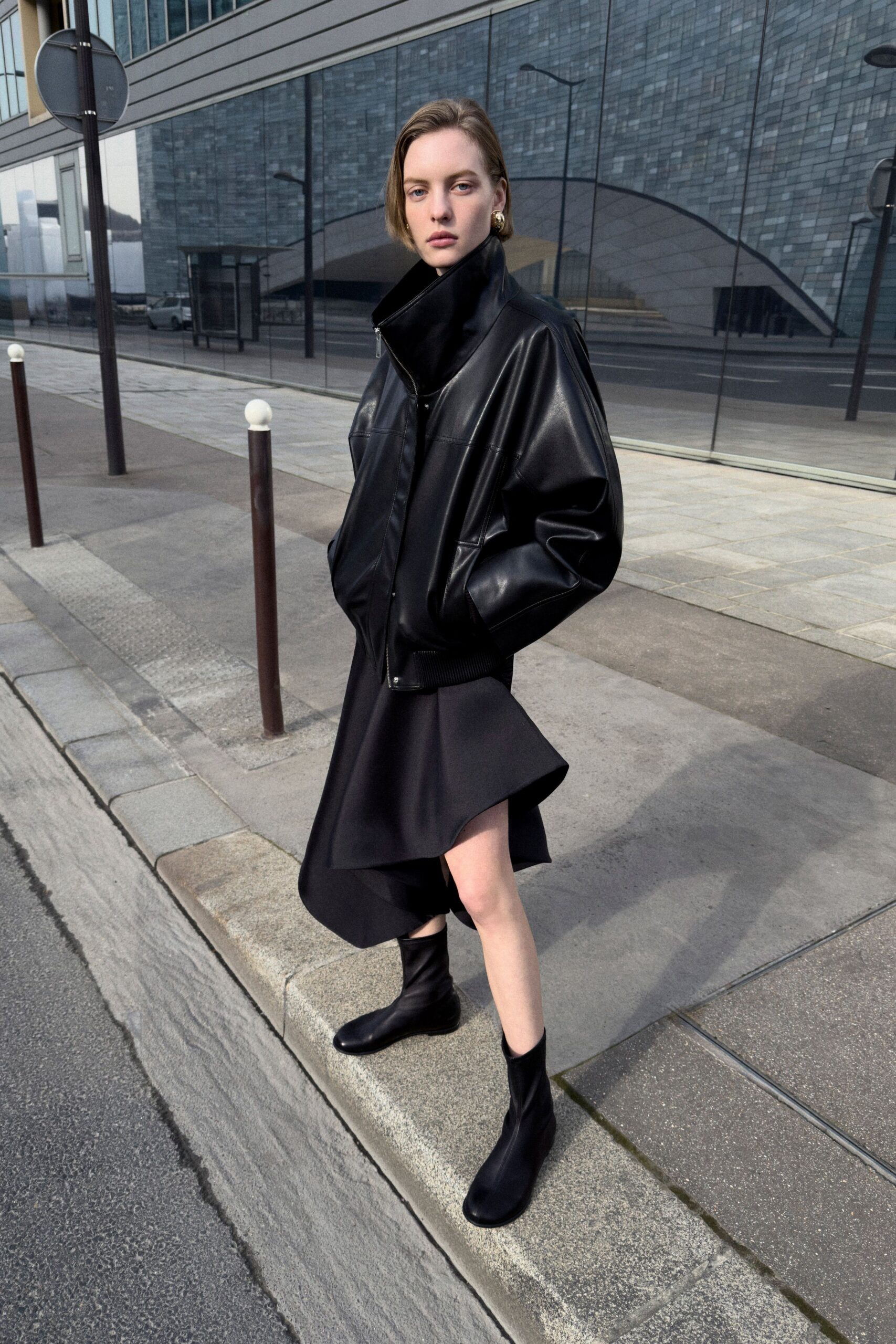black leather long-sleeve collared oversized jacket