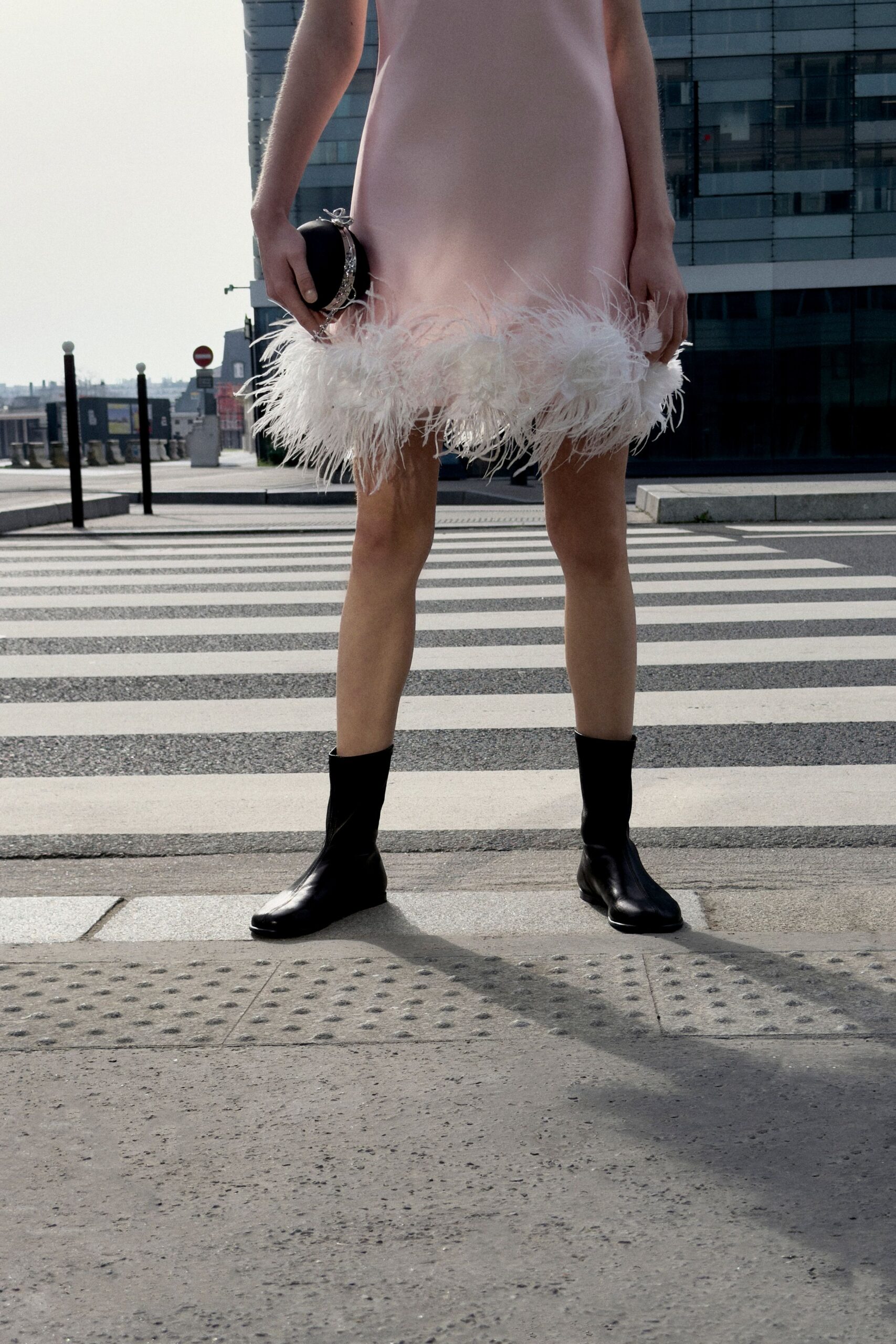pink fringed mini dress with black boots