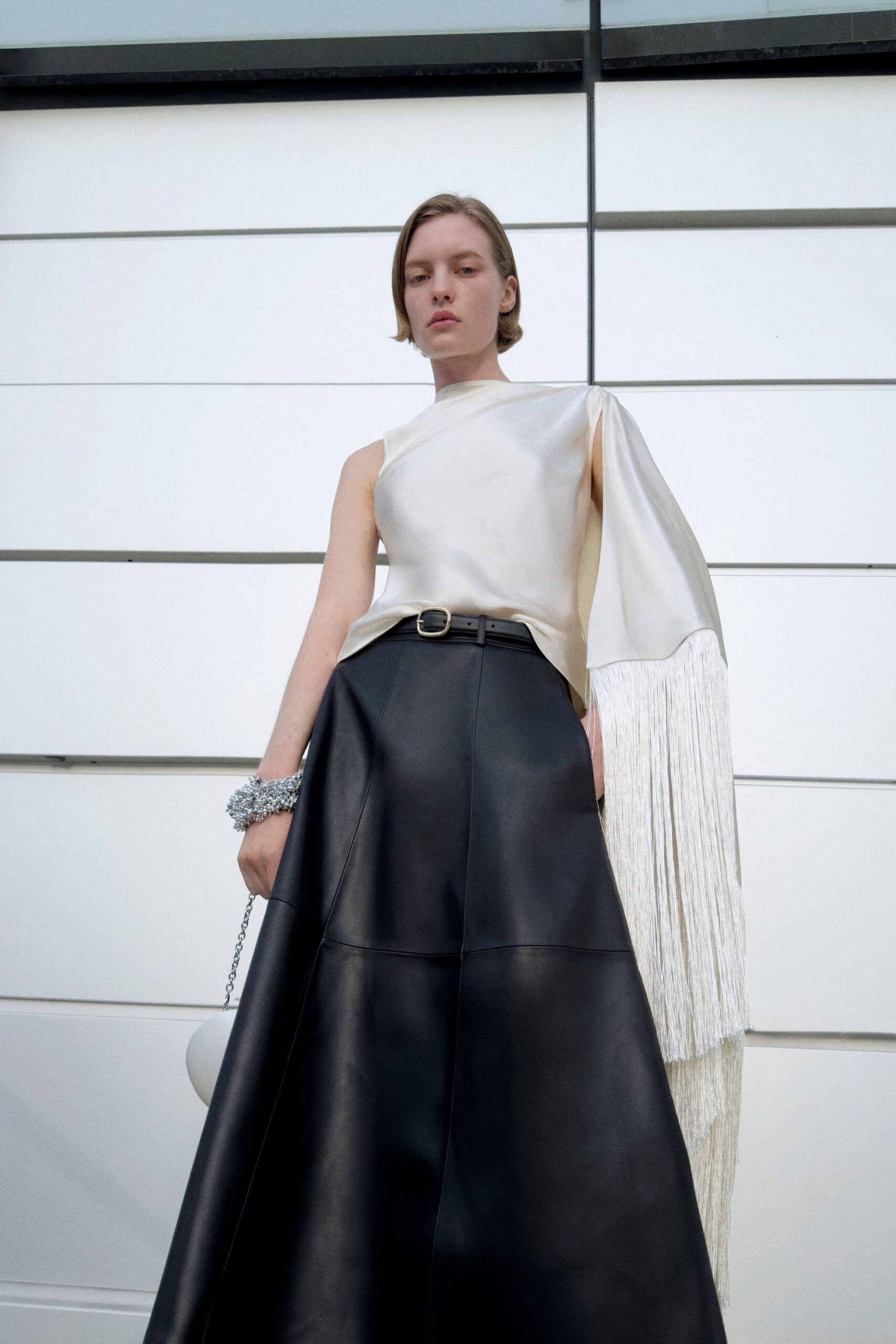 white silk sleeveless asymmetric fitted fringed top