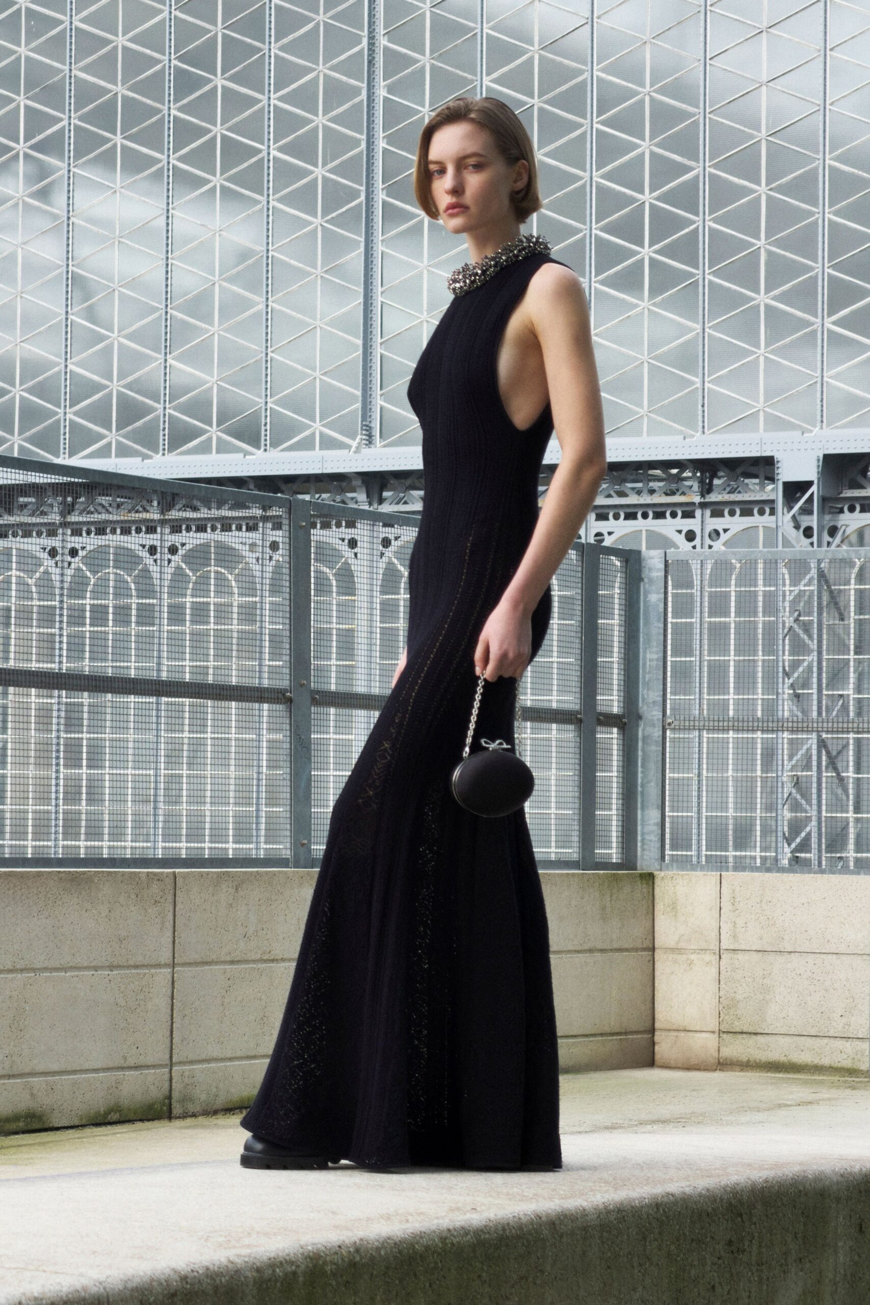 black knit sleeveless high-neck fitted flared maxi gown