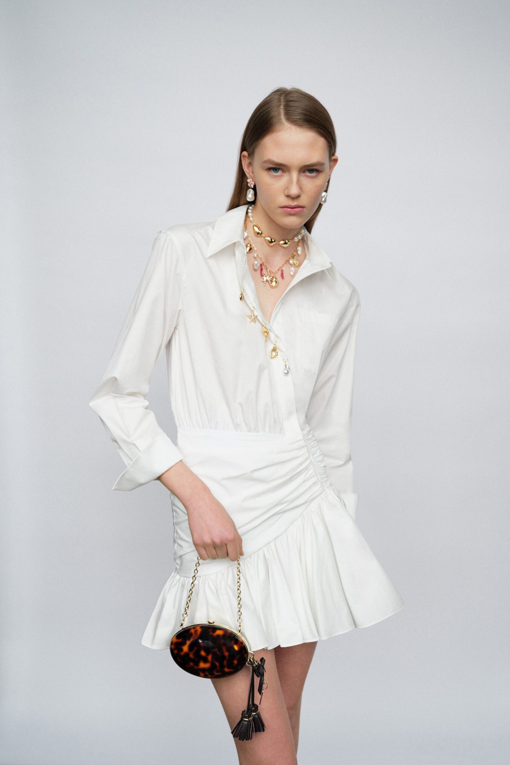 white cotton long-sleeve collared fitted pleated mini shirt-dress