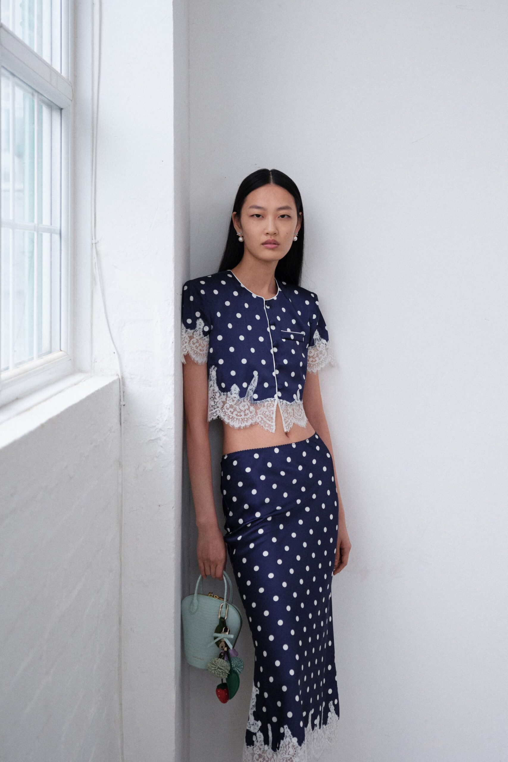 navy polka-dot top and skirt