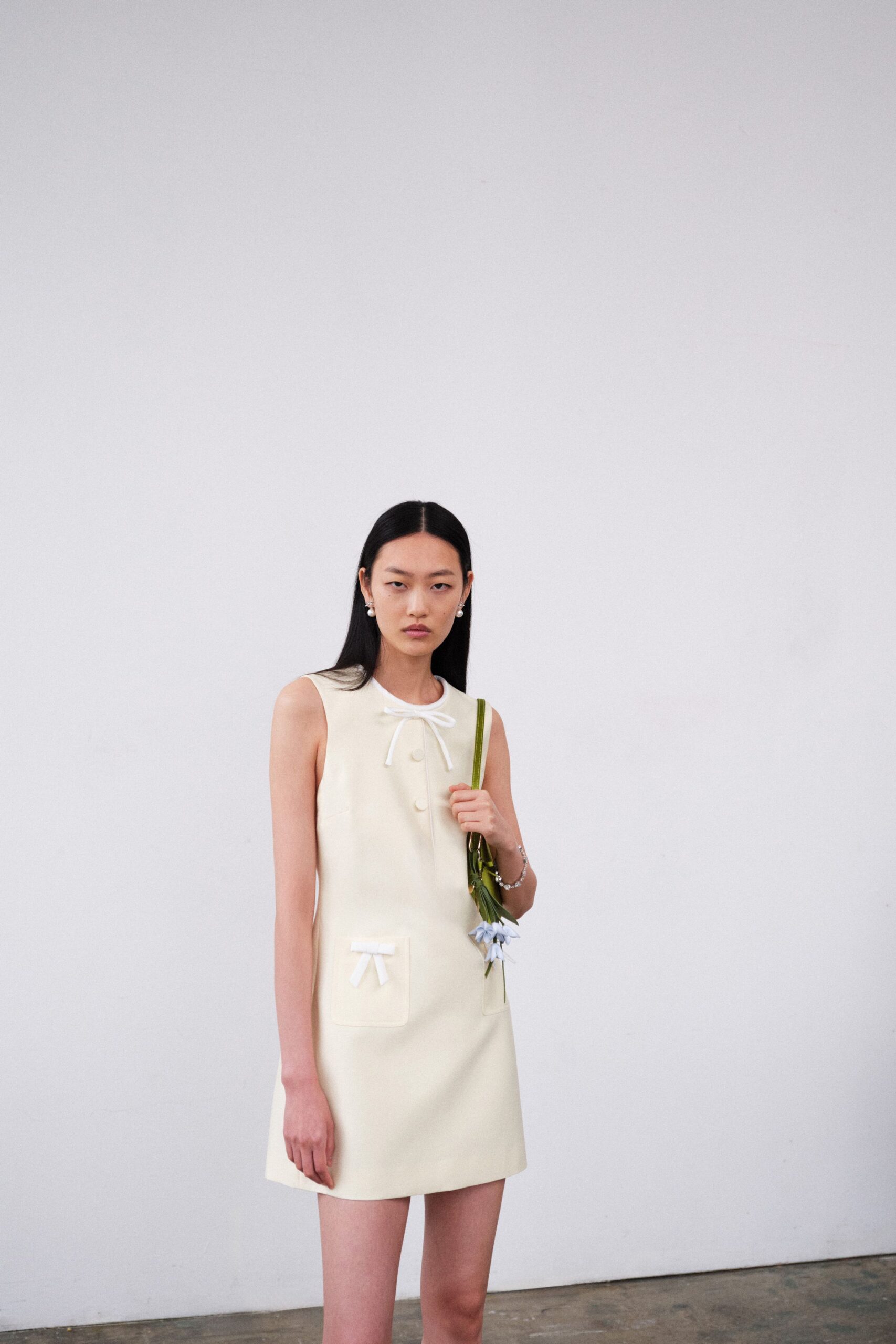 ivory fitted sleeveless mini-dress