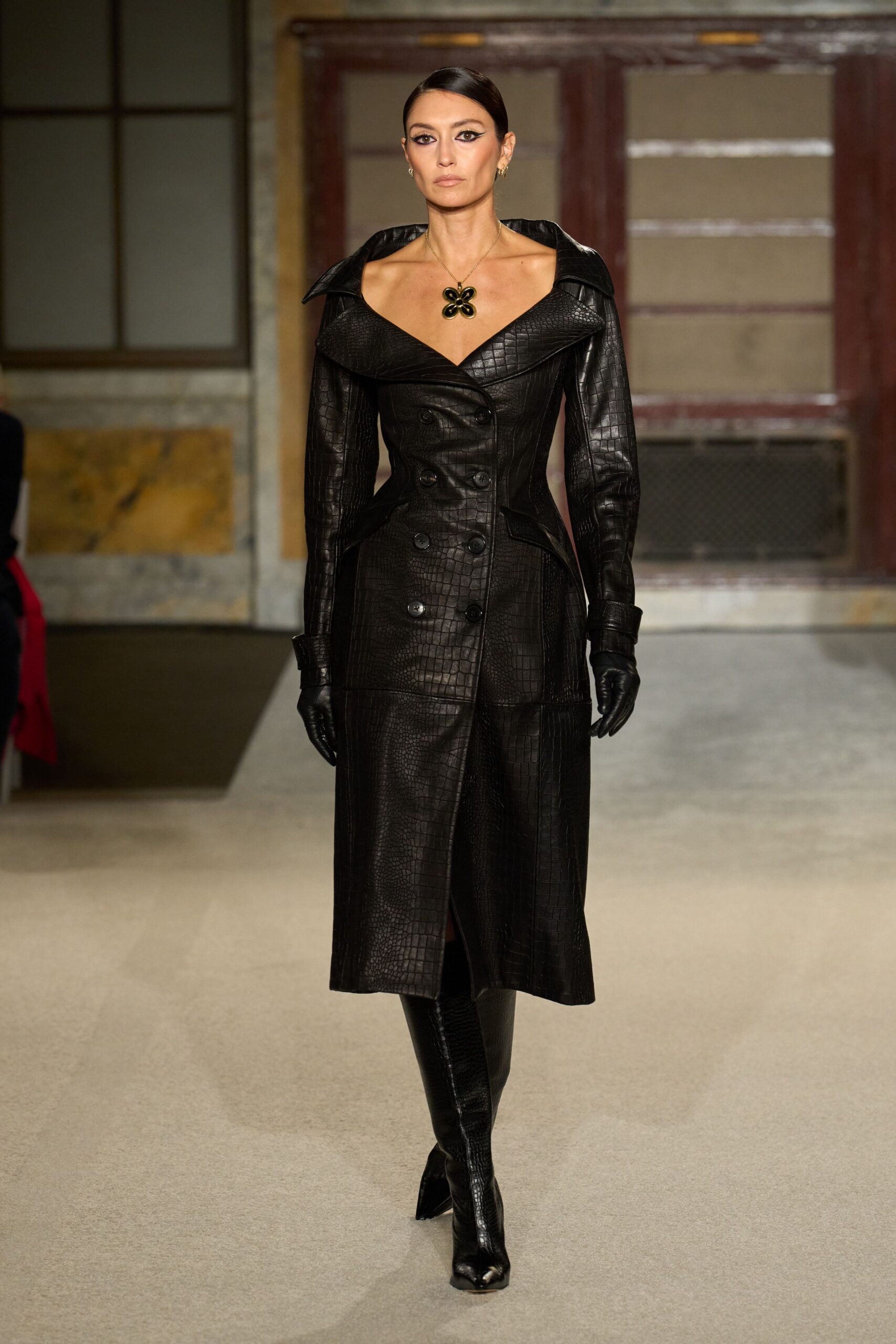 black leather long-sleeve collared fitted buttoned textured coat