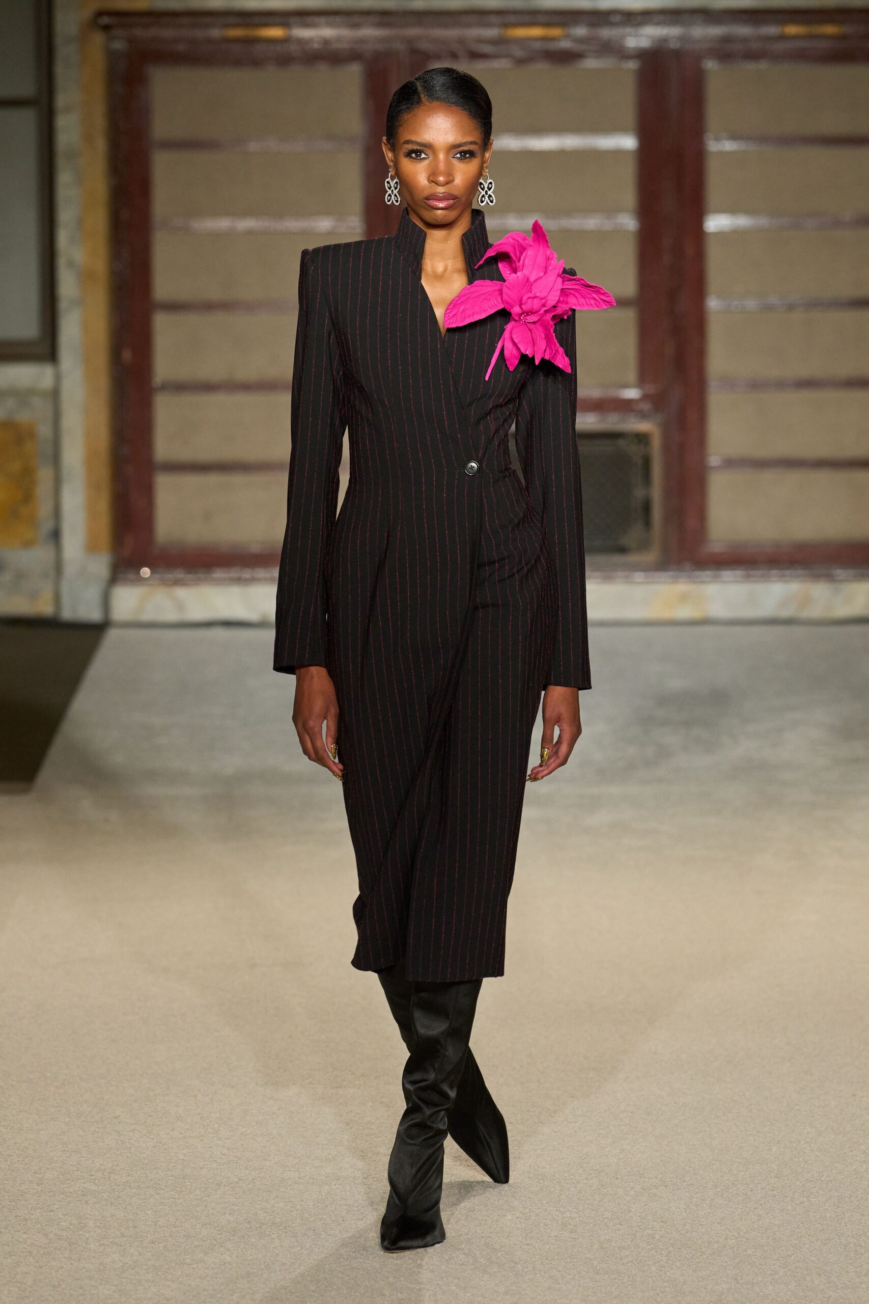 black fitted midi dress with pink embellishment