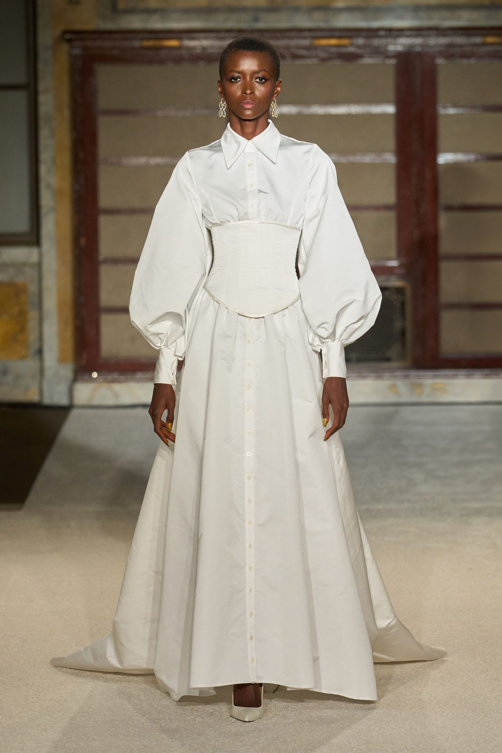 white cotton long-sleeve collared fitted buttoned tiered gown