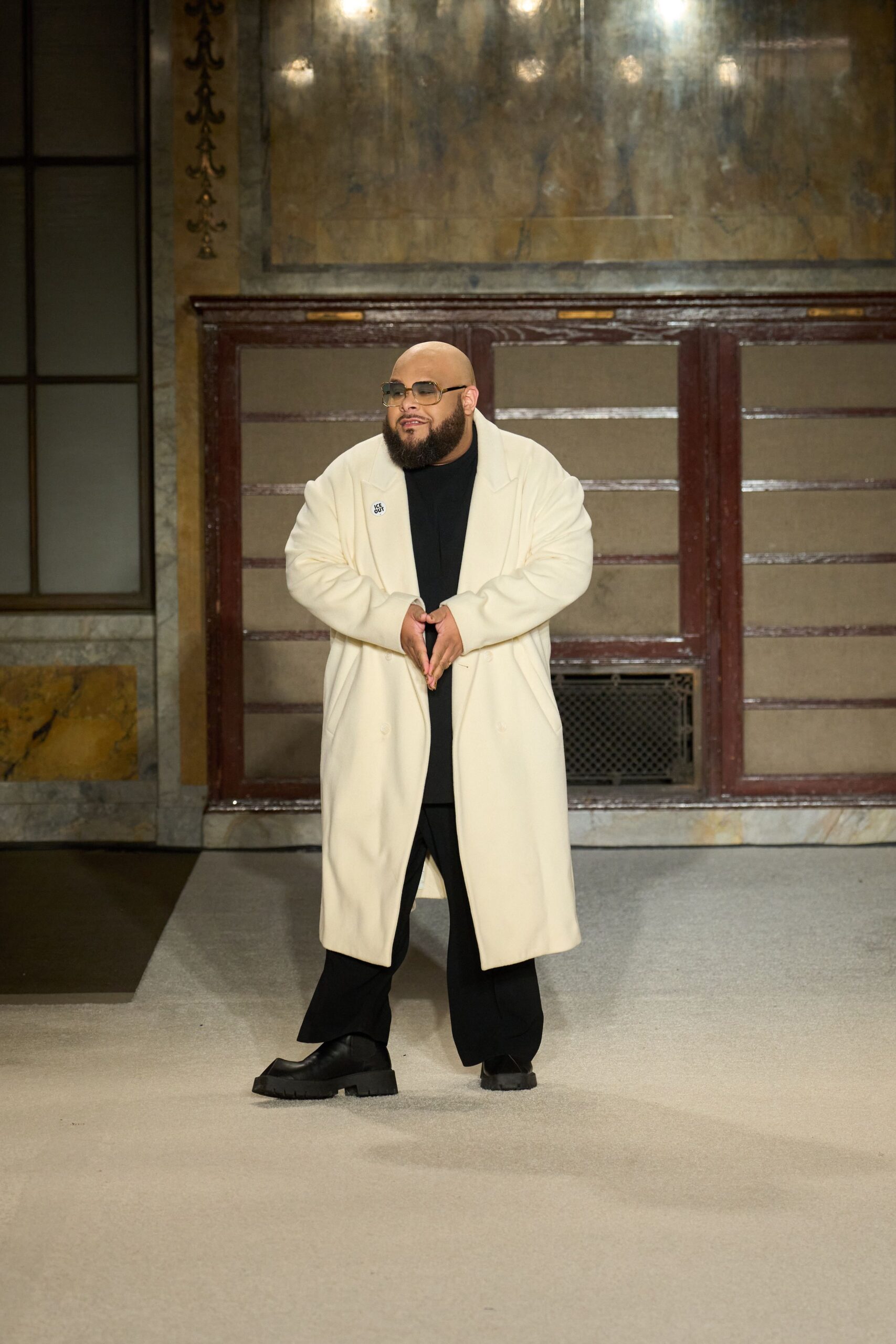 white wool relaxed coat with black pants