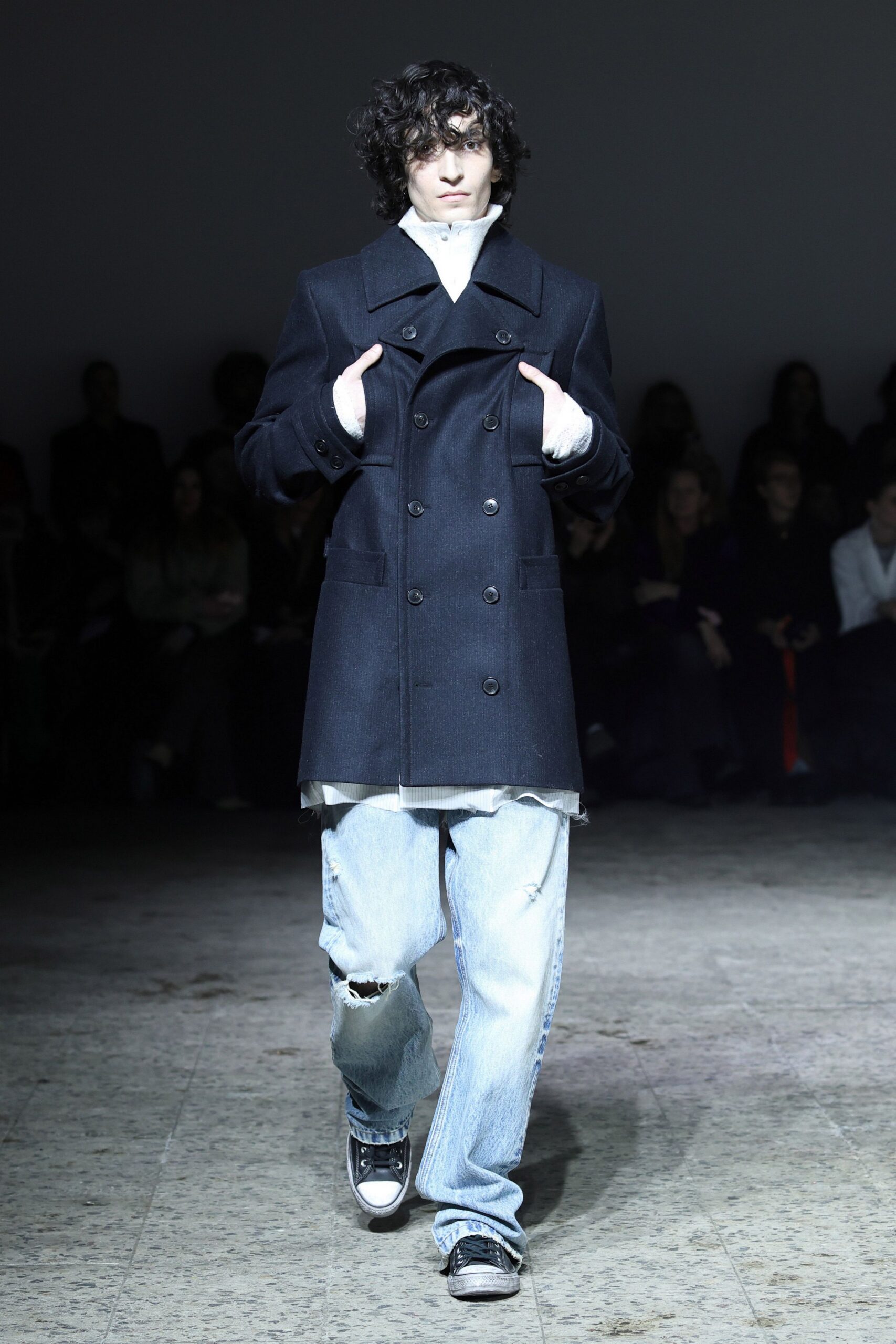 black wool coat with distressed jeans