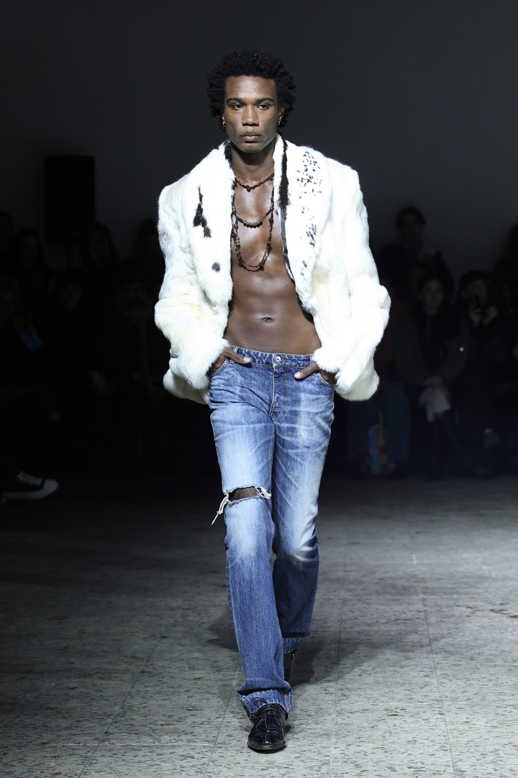 white faux-fur jacket with blue jeans