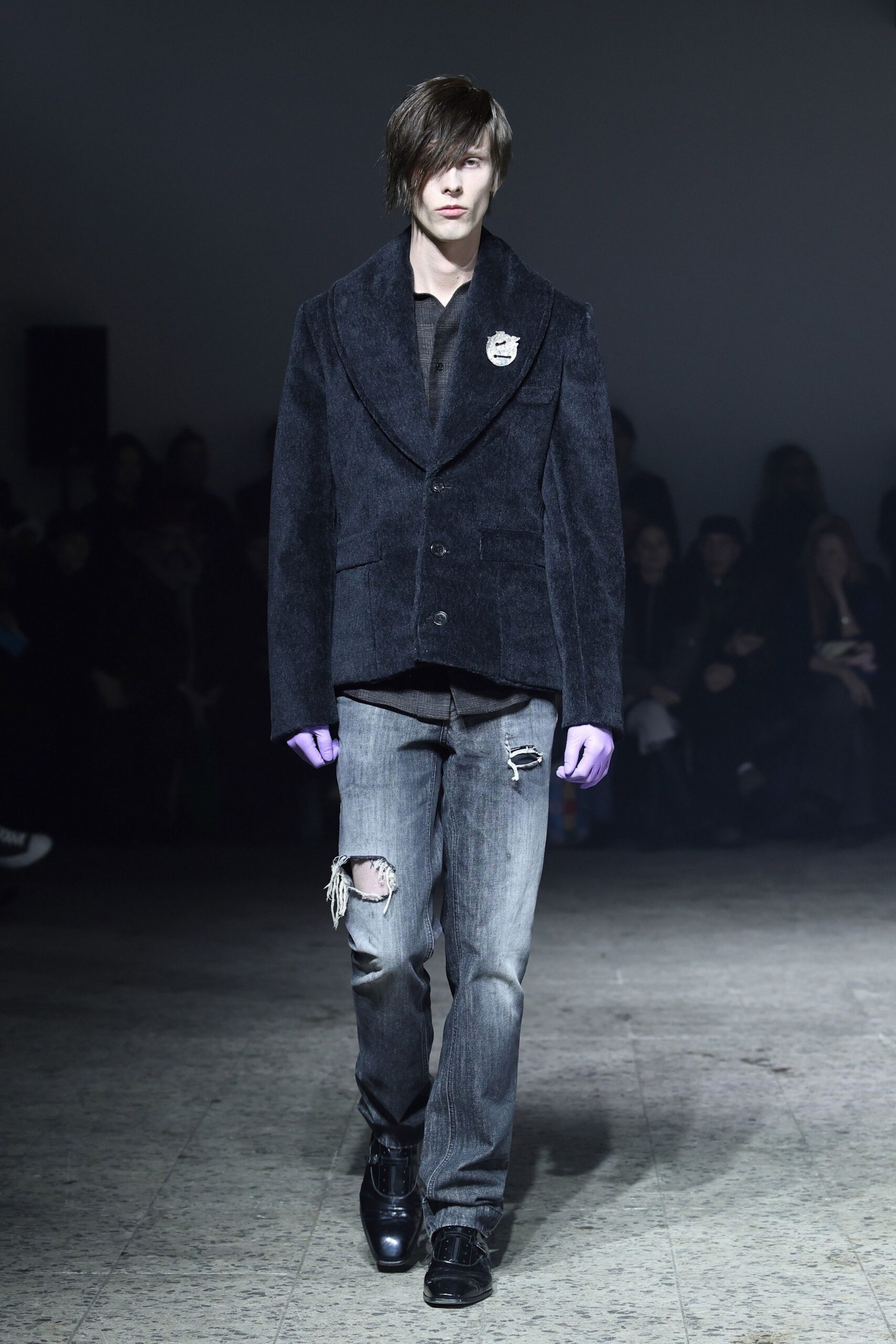 black structured jacket with distressed jeans
