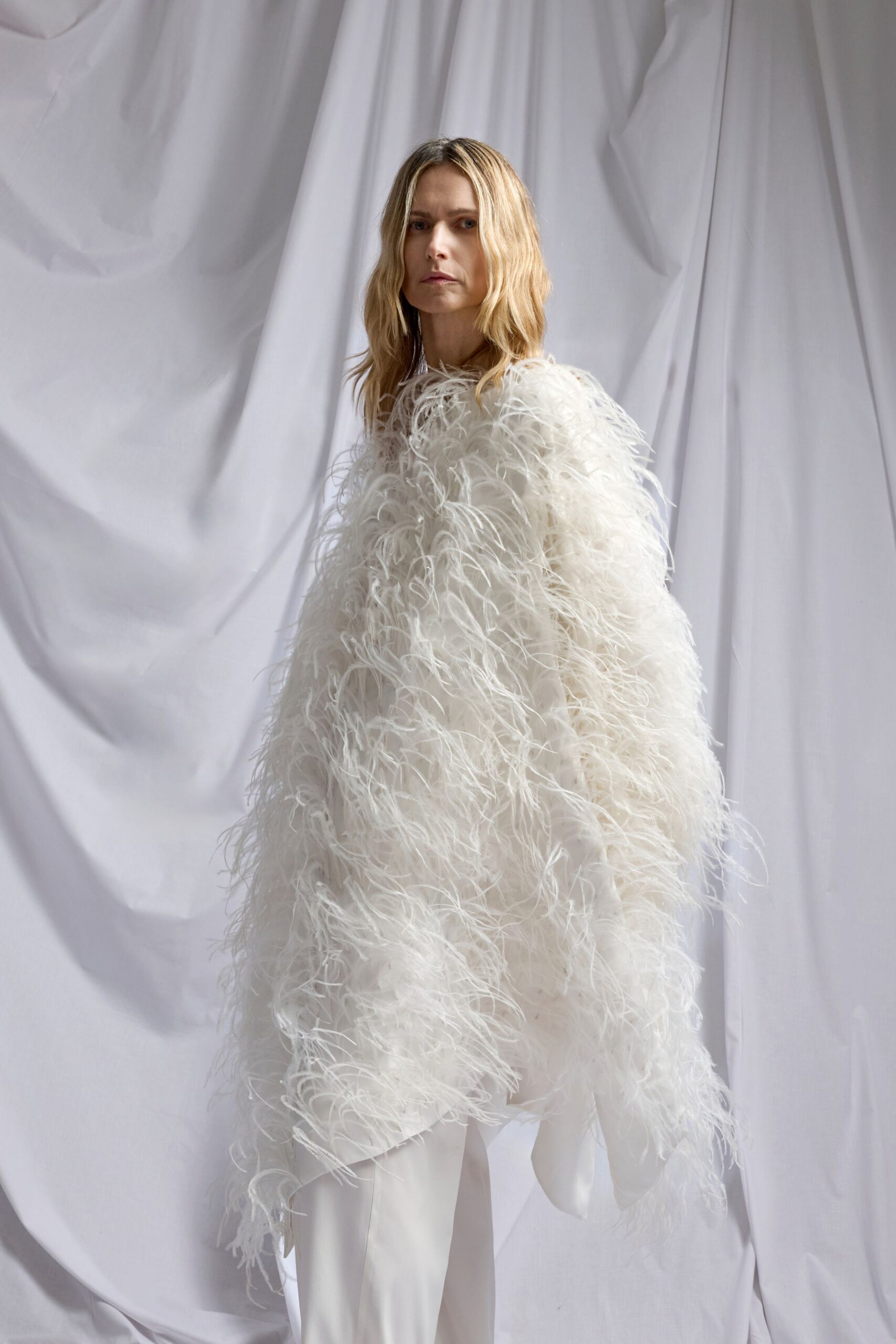 white fur oversized fringed cape