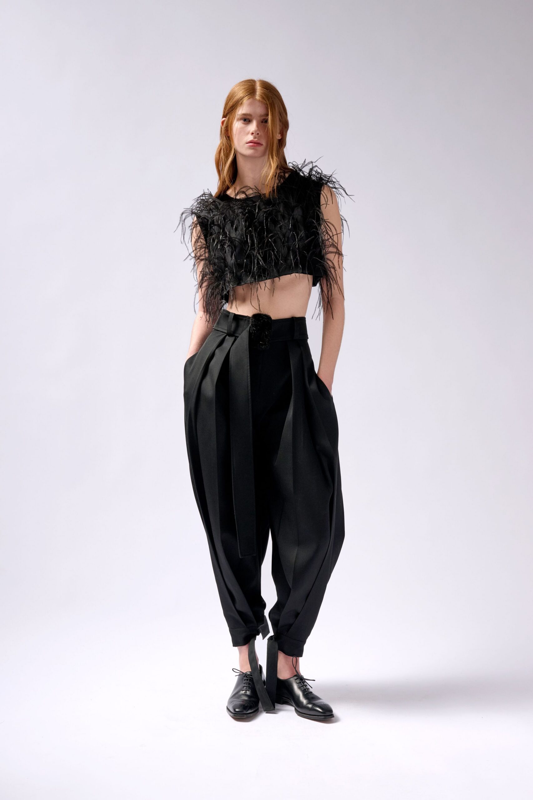 black feather sleeveless fitted fringed top