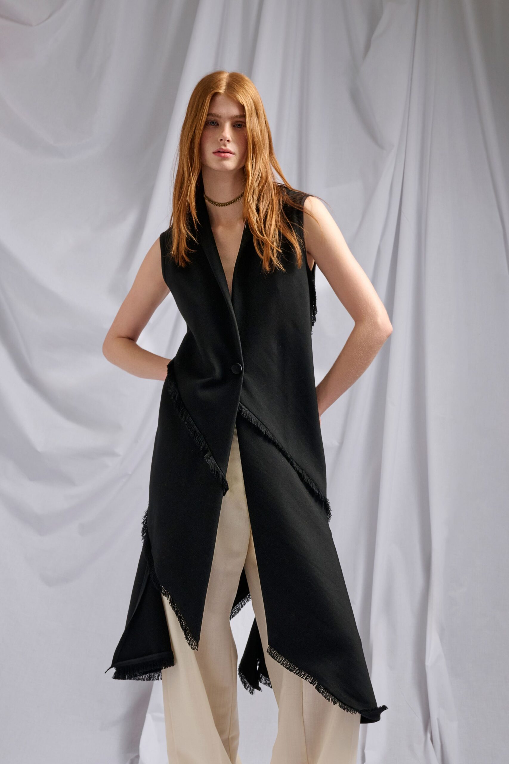 black wool sleeveless collared relaxed fringed vest