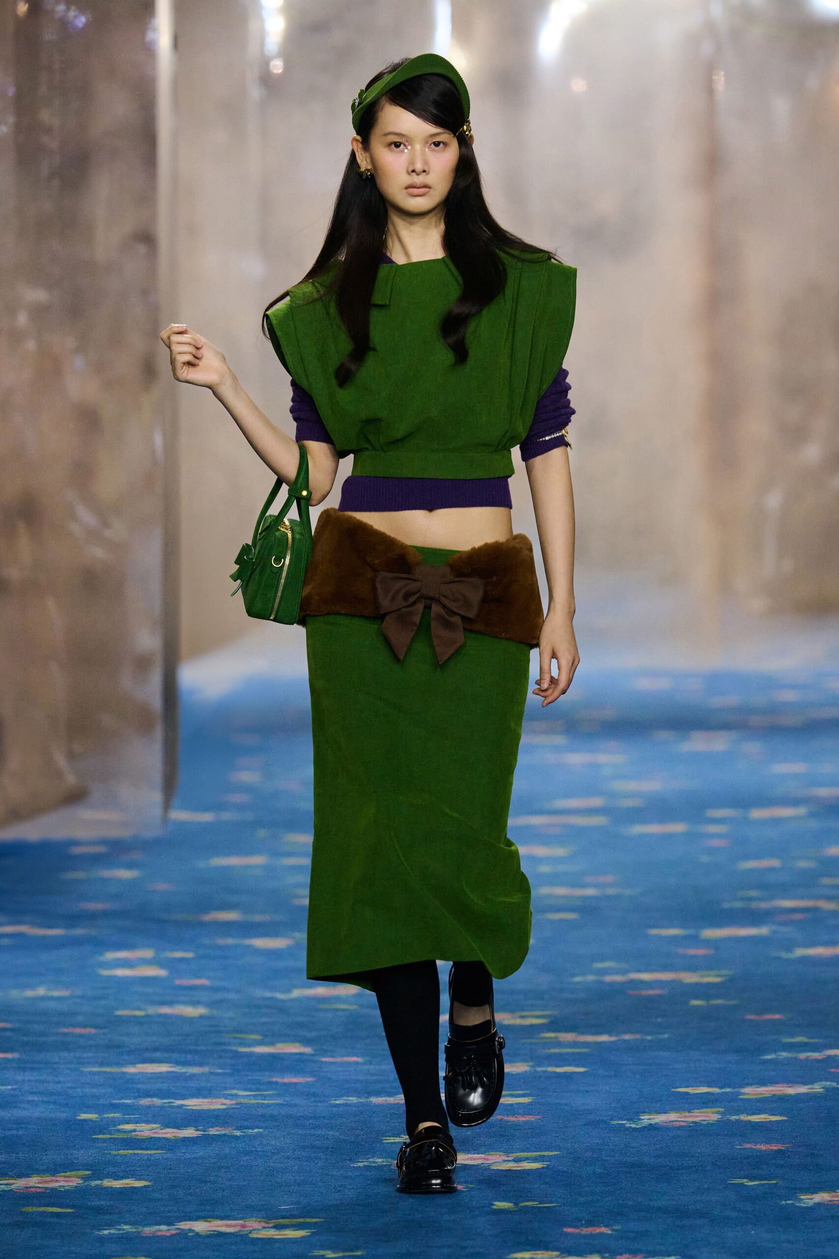 green fitted top and skirt