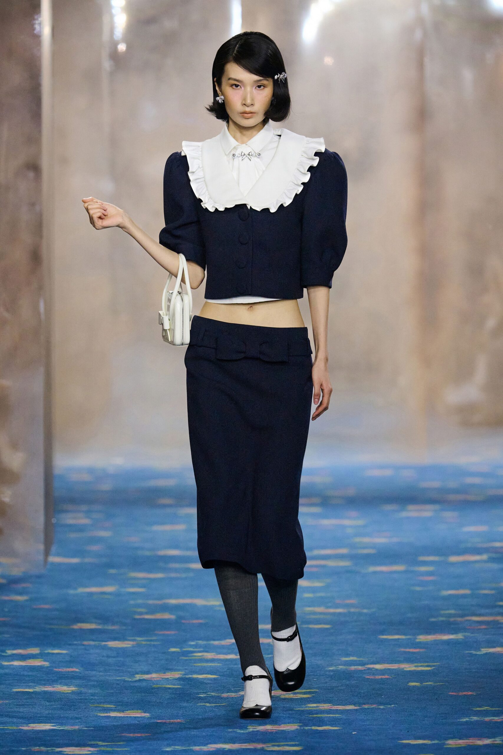 navy fitted top and skirt