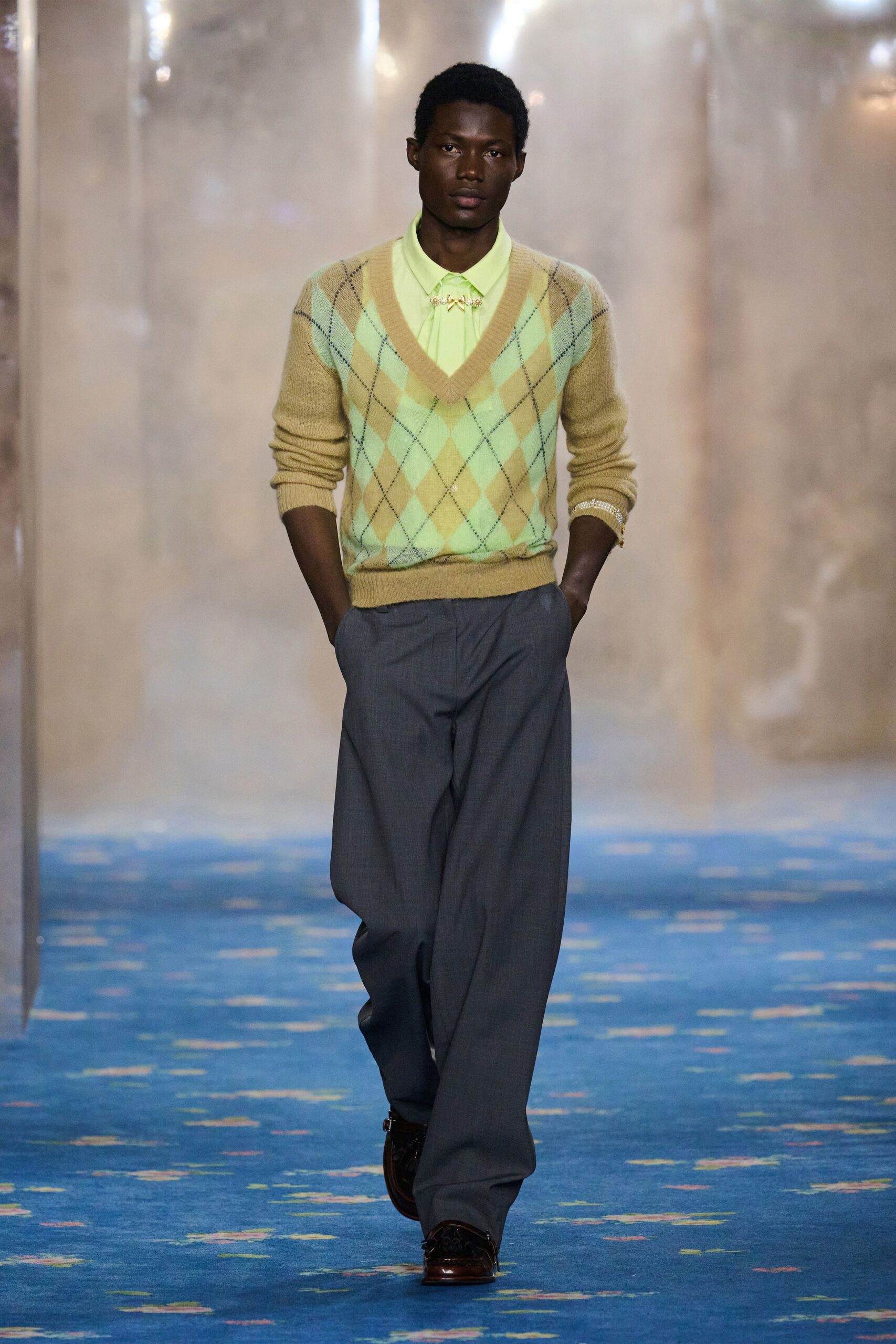 yellow green argyle sweater with gray pants
