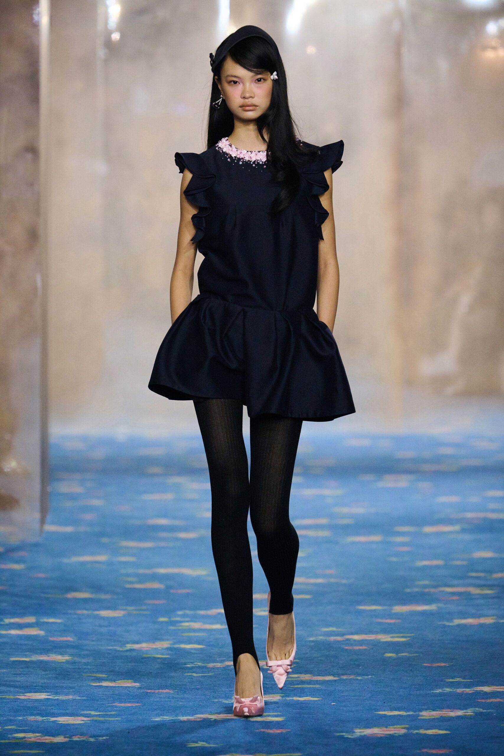 navy ruffled top with black leggings