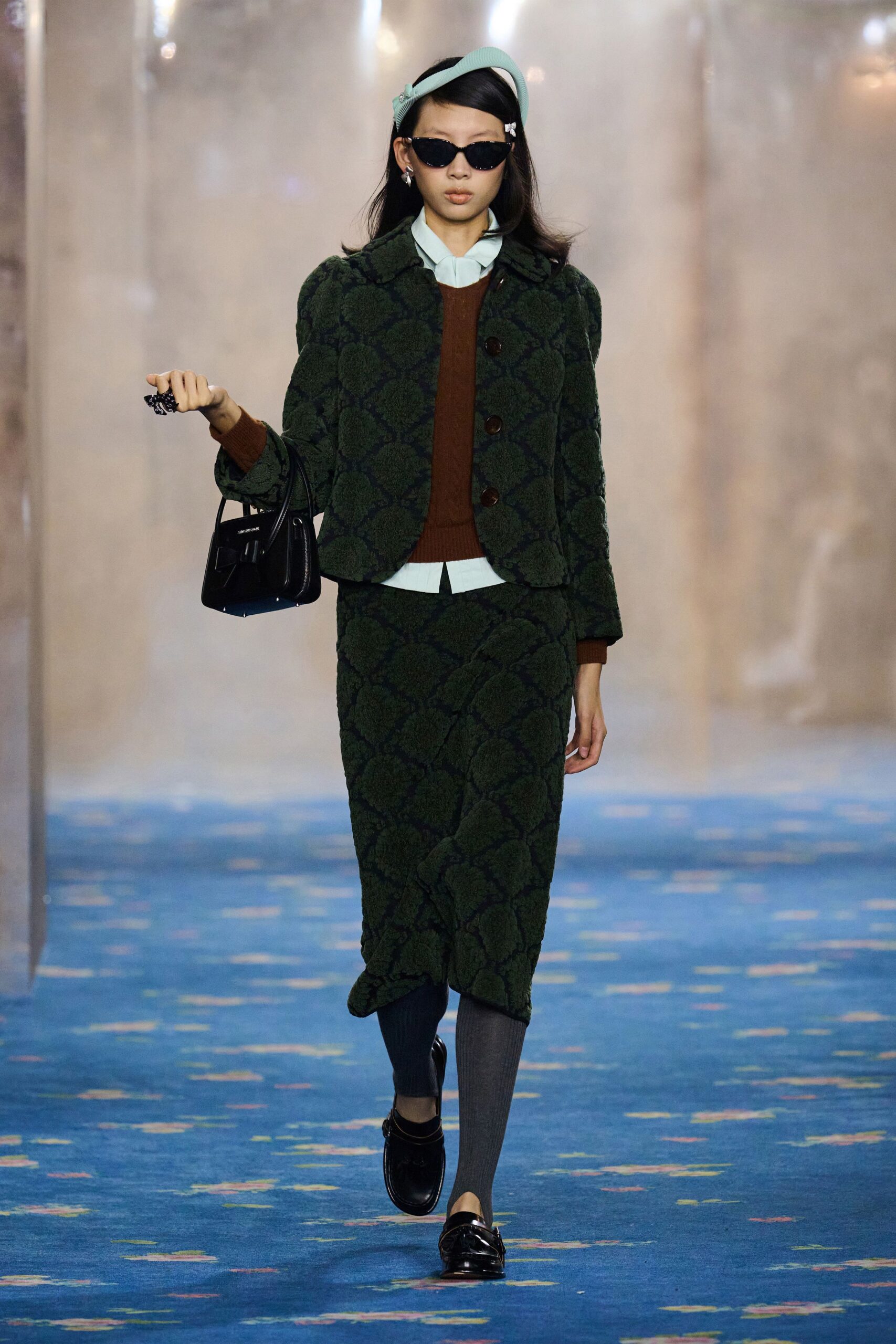 green tweed blazer and skirt