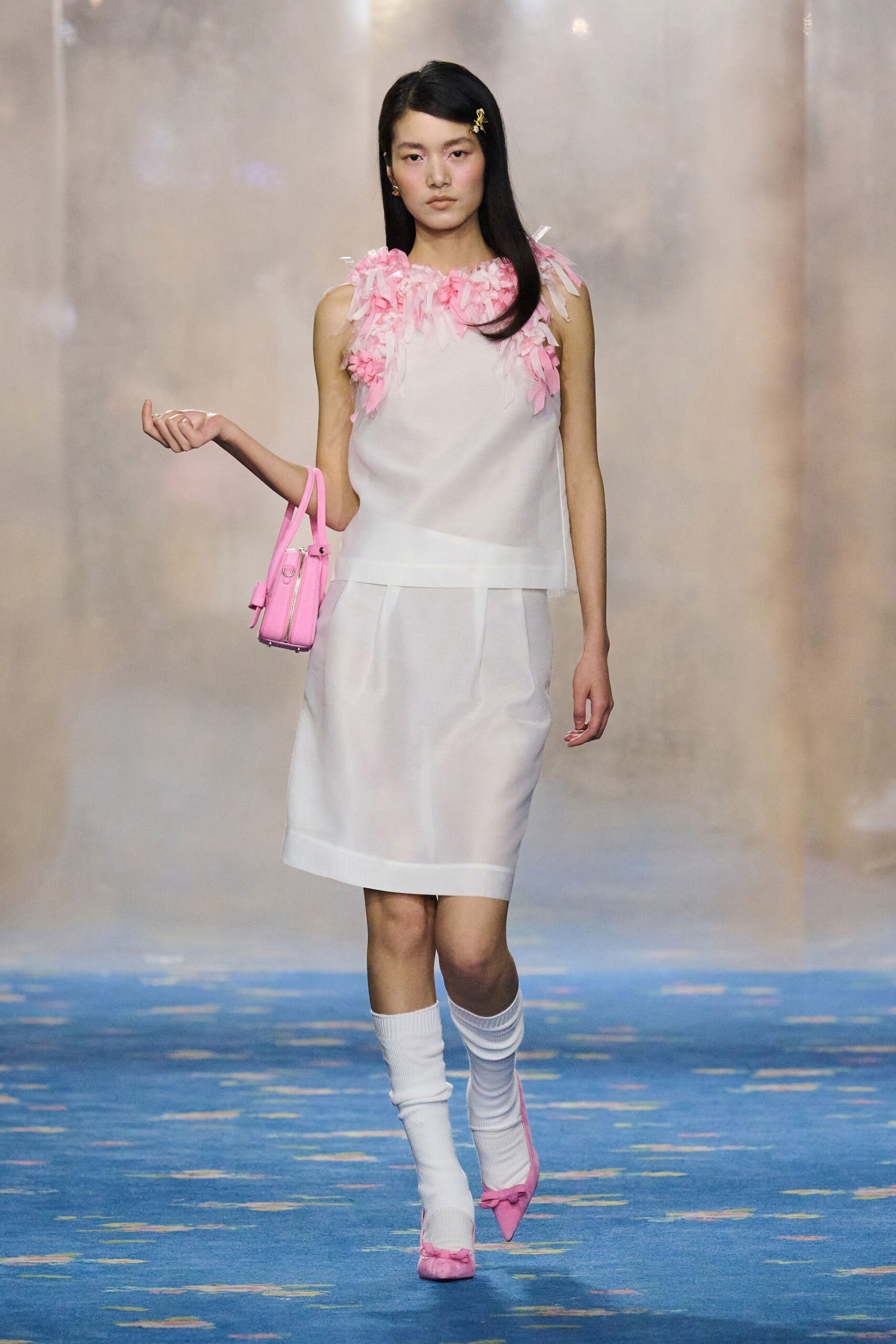 white mini dress with pink ruffles