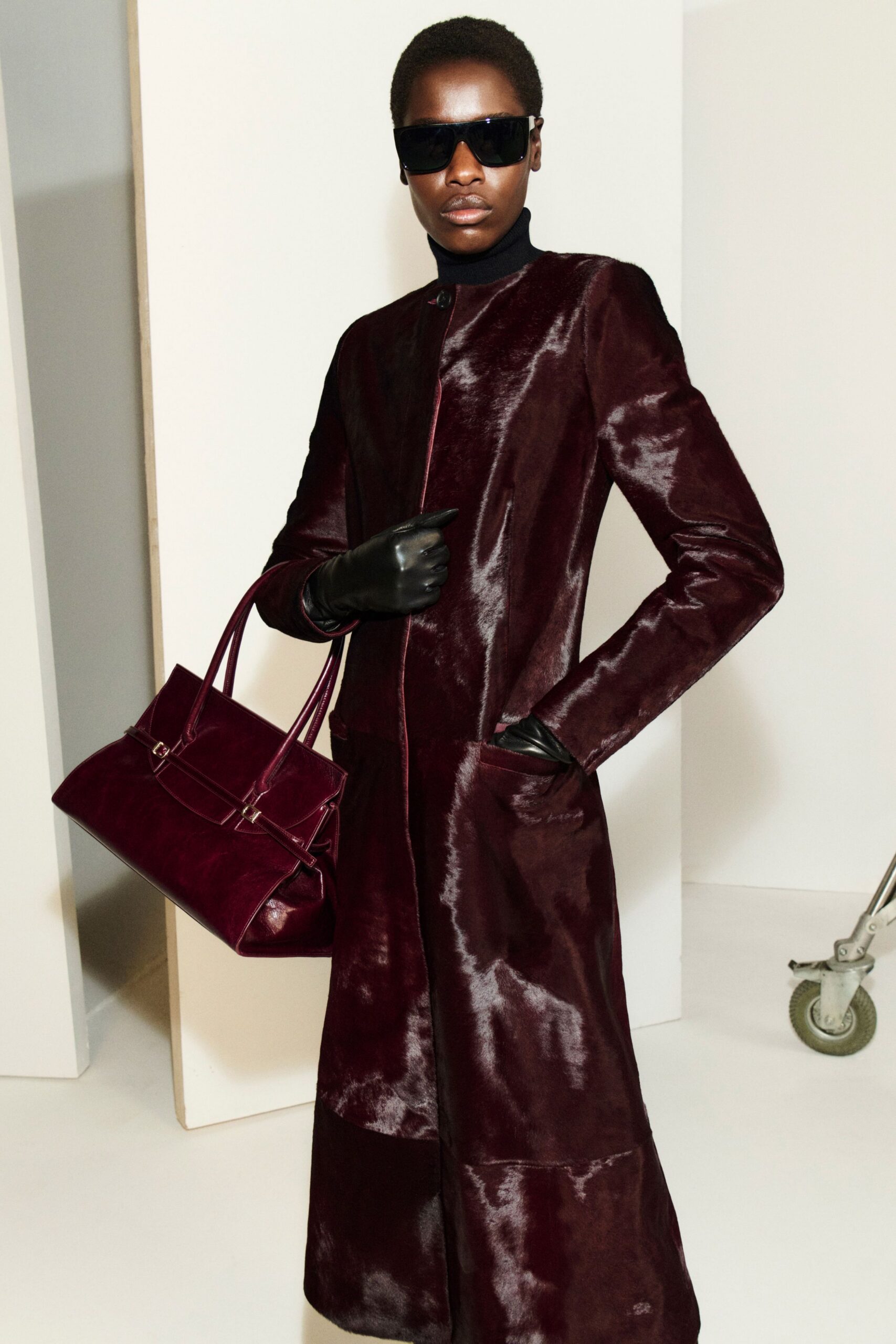 maroon leather long-sleeve collared fitted zippered pockets coat