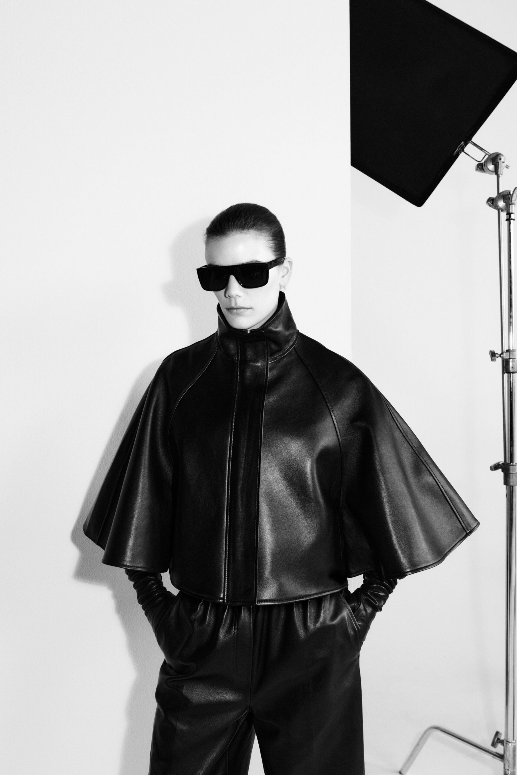 black leather long-sleeve collared fitted structured zippered jacket