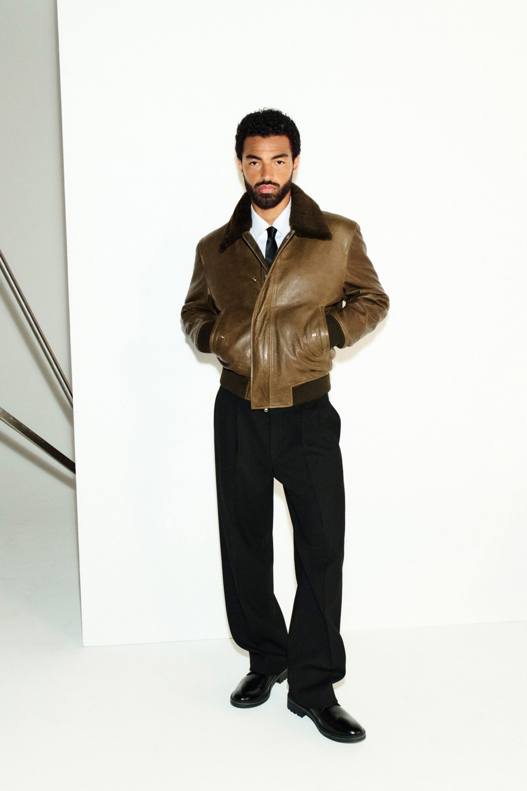 brown leather long-sleeve collared fitted jacket