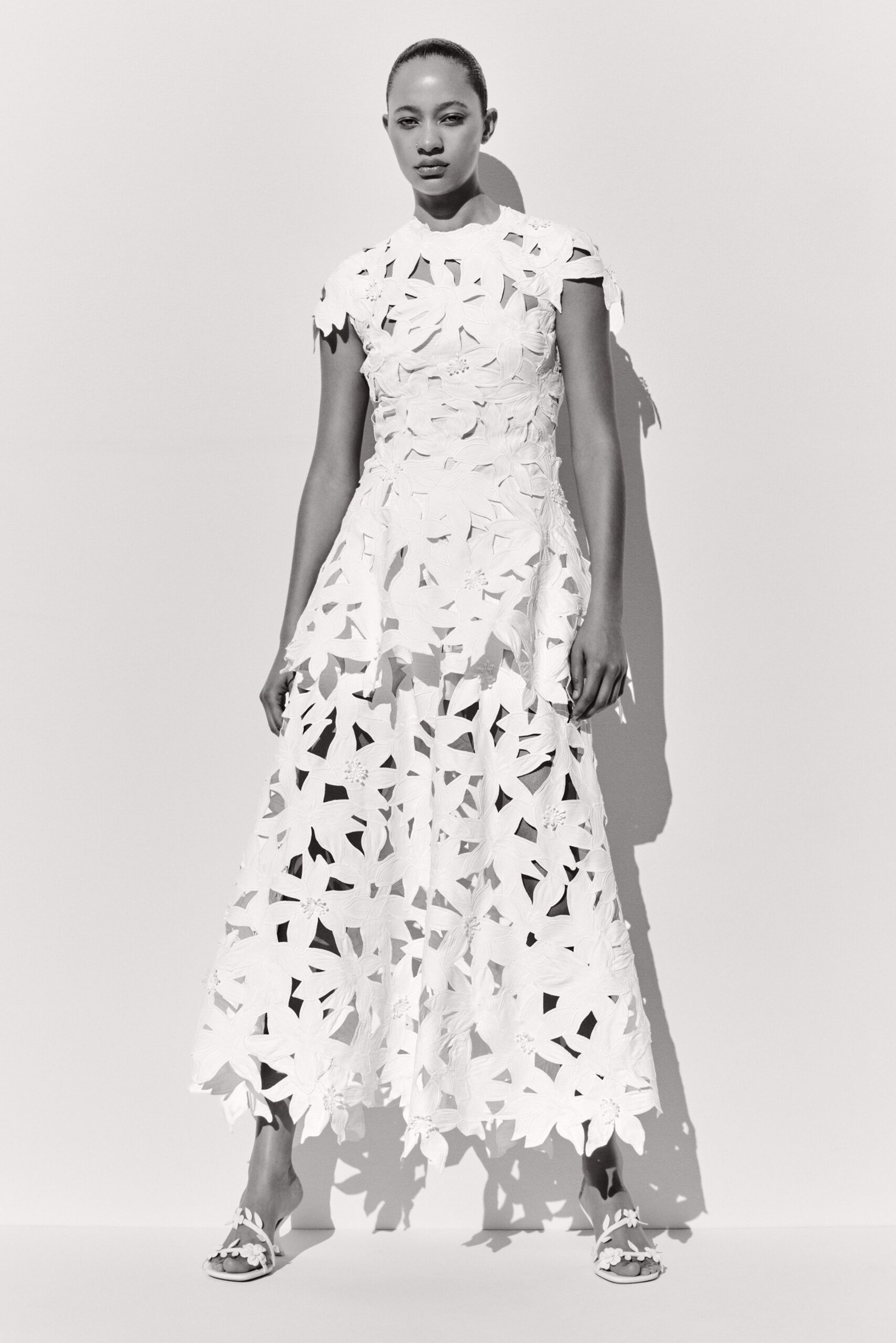 white cotton short-sleeve fitted pleated layered maxi gown