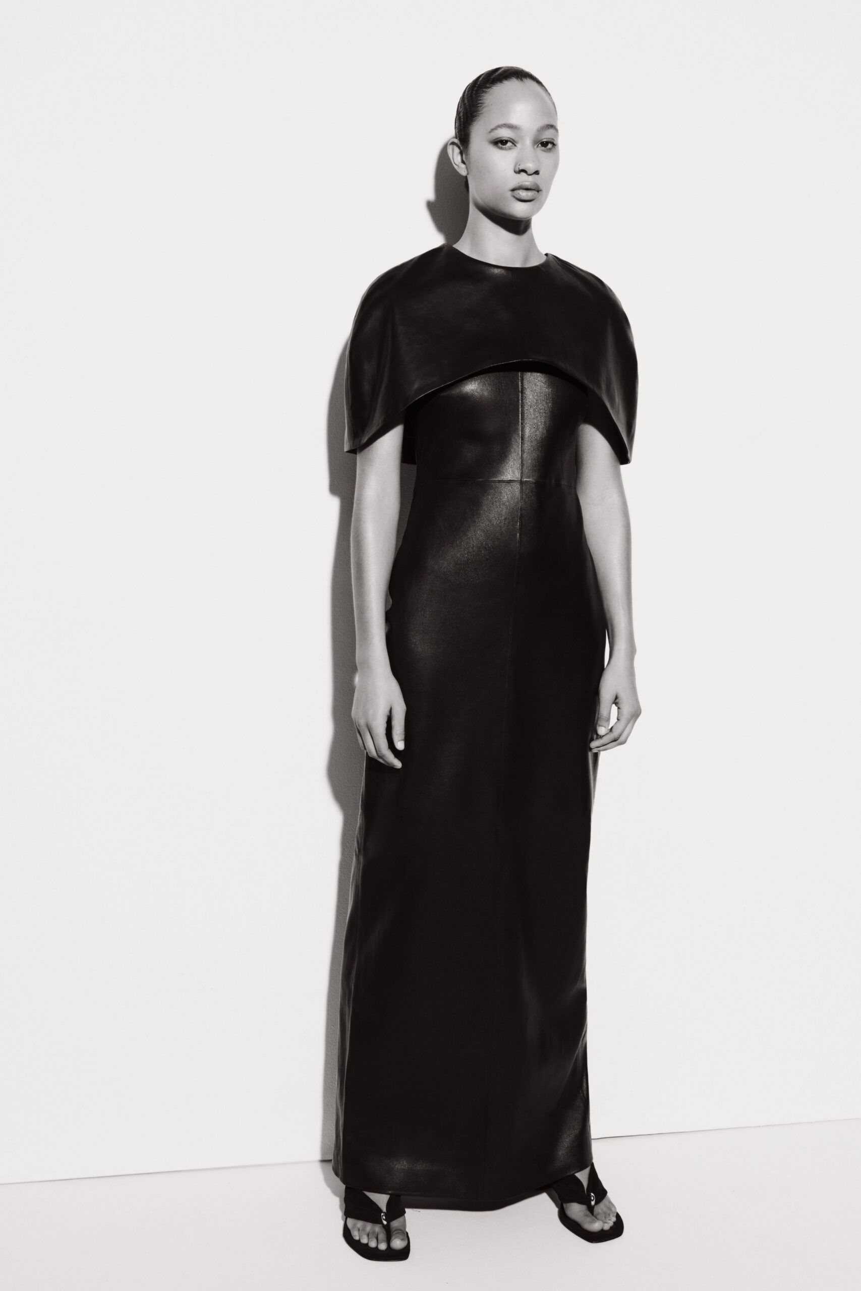 black leather sleeveless high-neck fitted draped maxi gown
