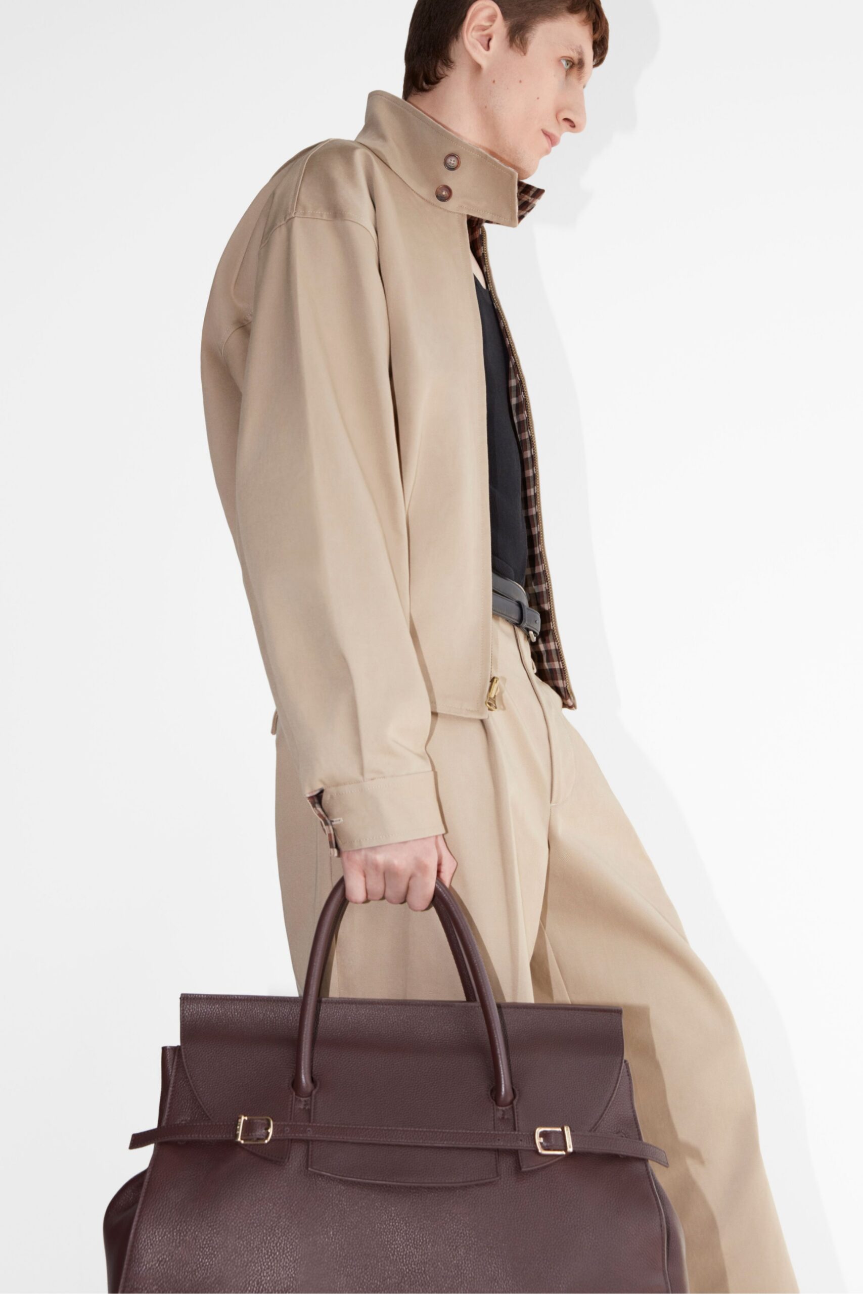 beige jacket and pants with brown bag