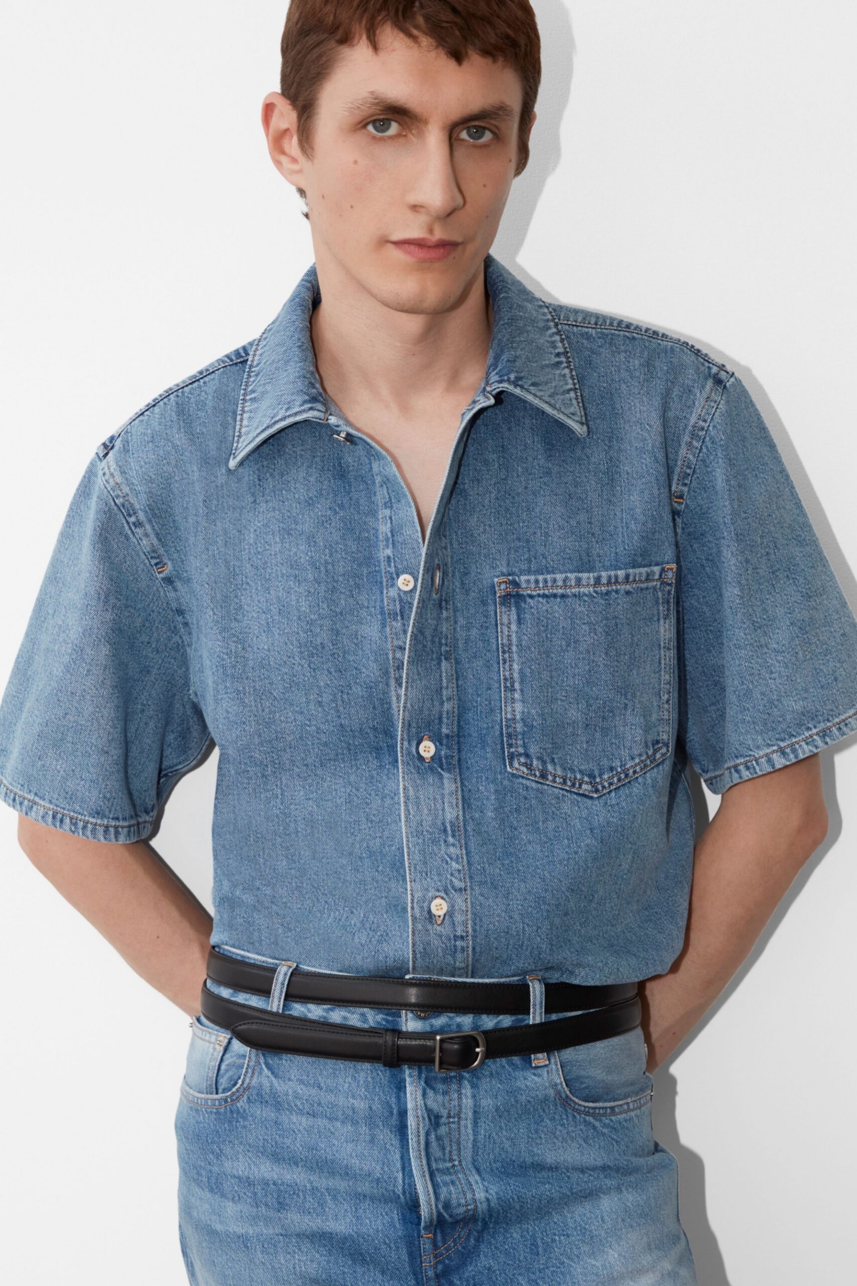 blue denim short-sleeve collared relaxed buttoned pockets shirt