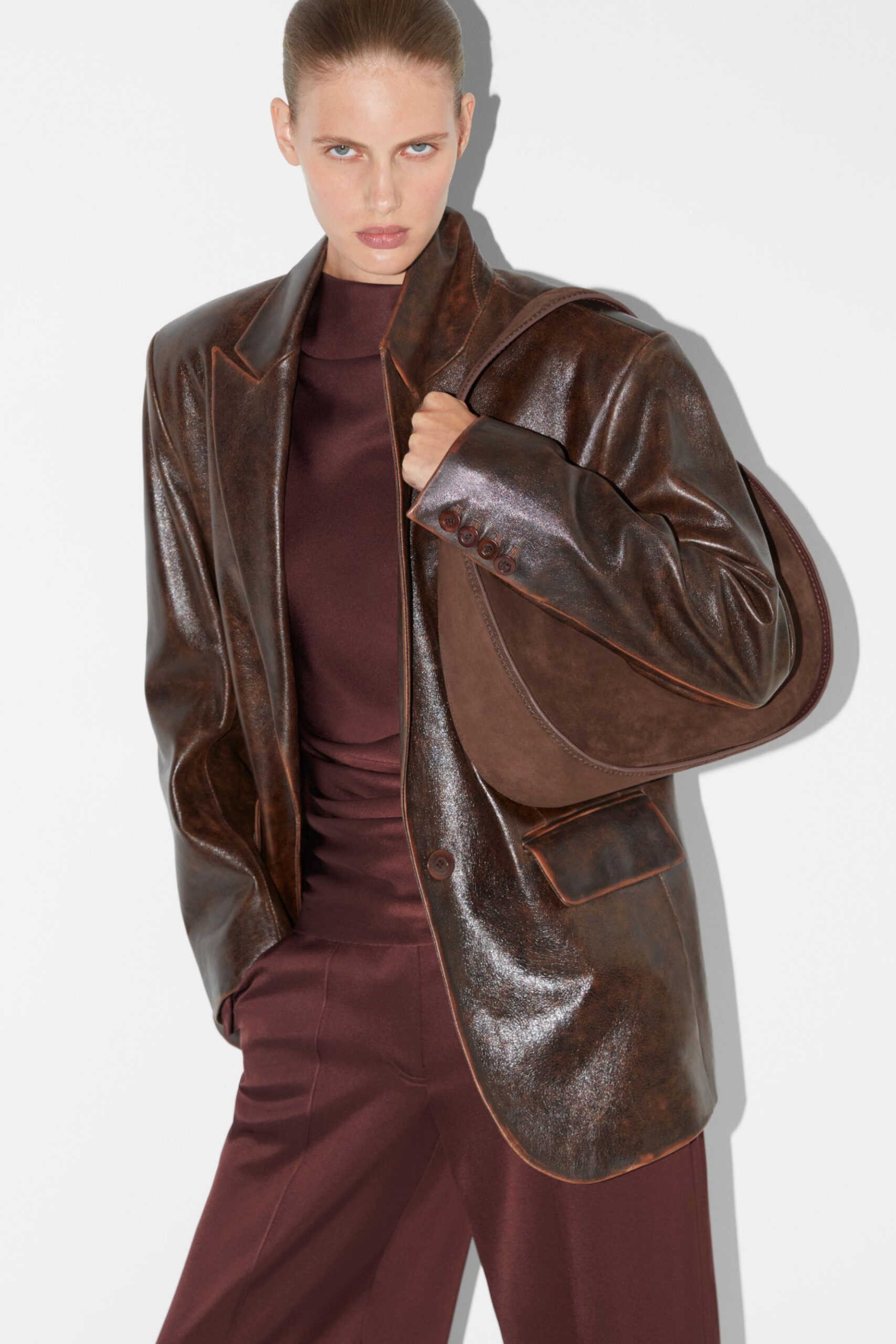 brown leather long-sleeve collared oversized buttoned shiny blazer