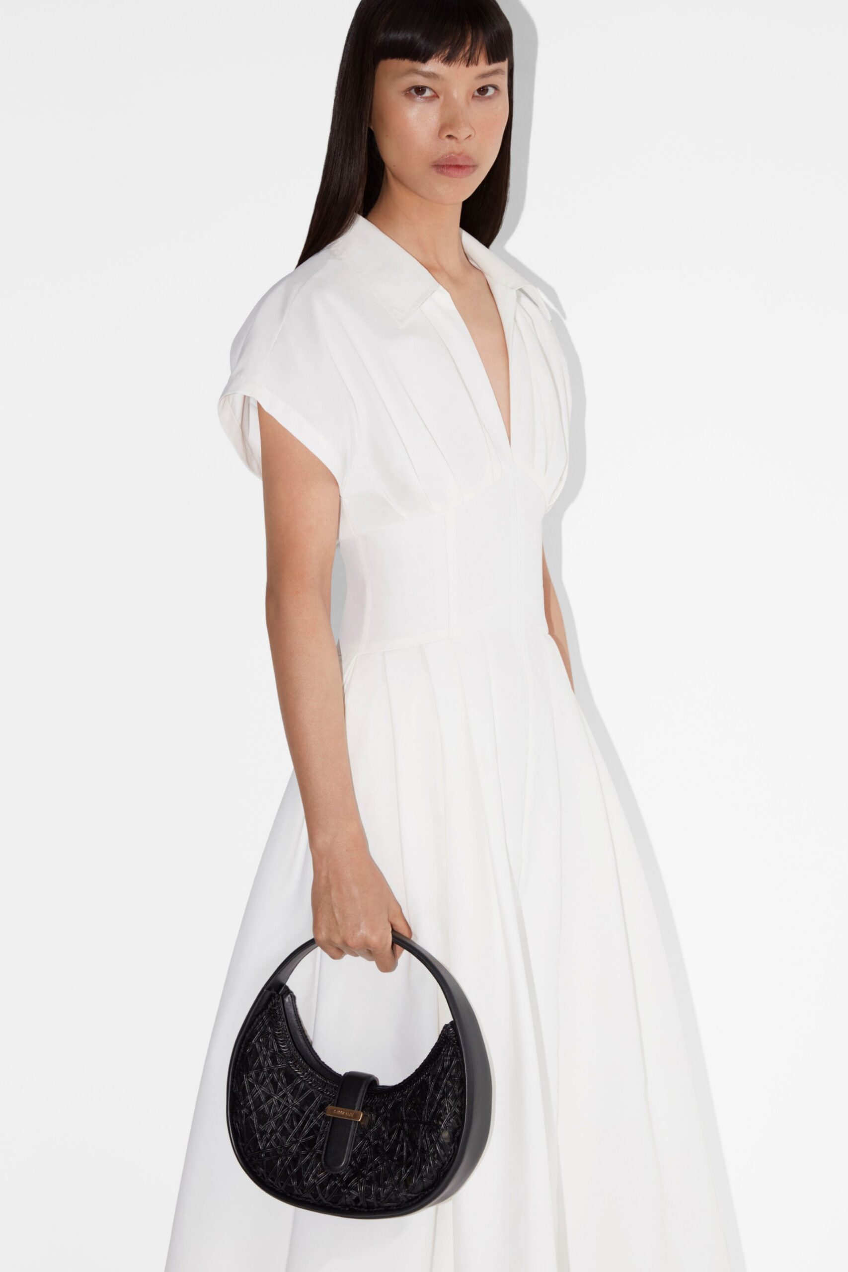 white cotton short-sleeve v-neck fitted pleated maxi dress