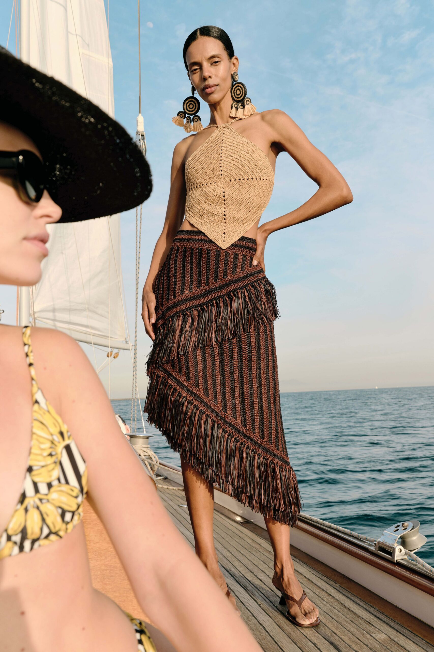 beige crochet top and brown fringed skirt