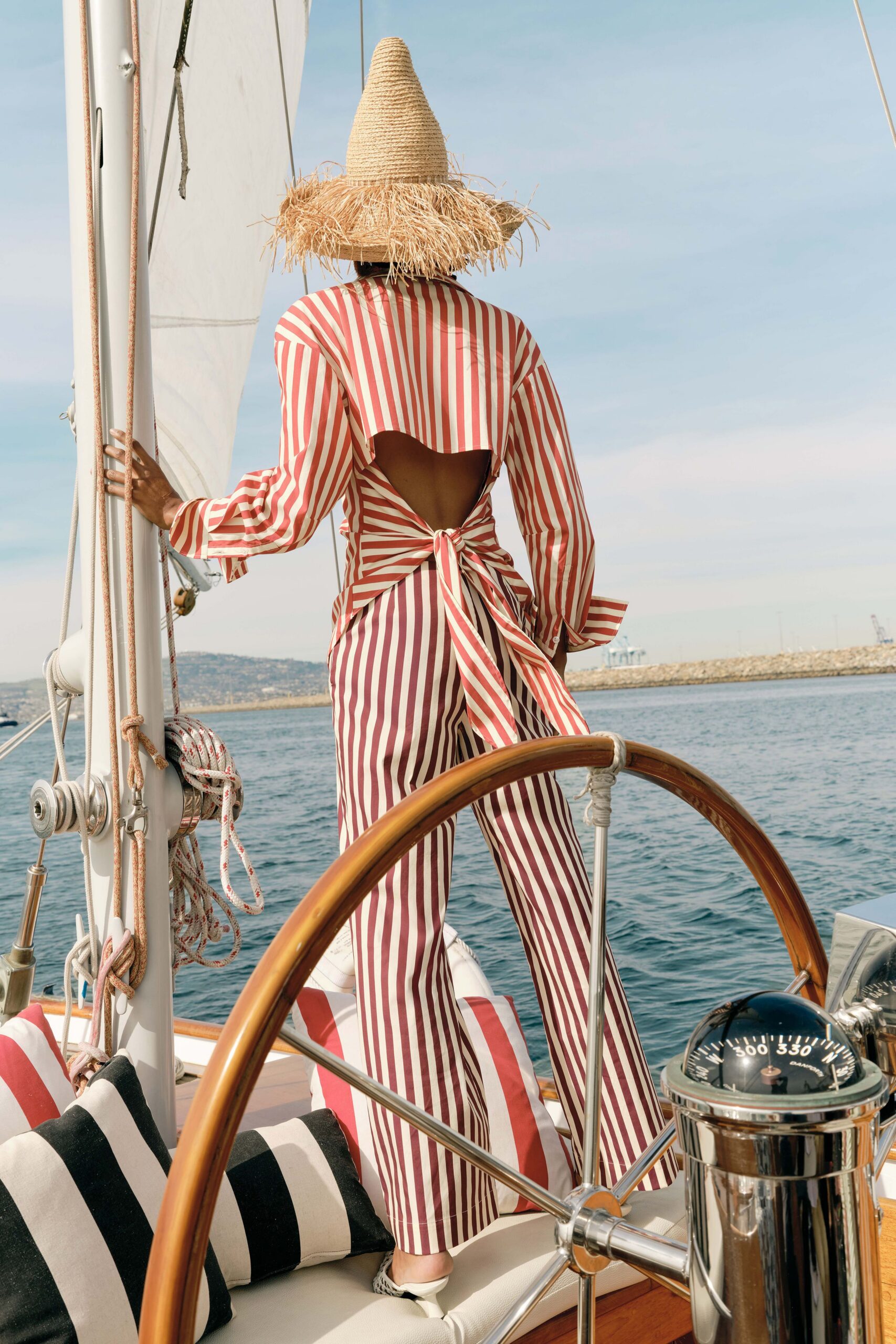 red cotton long-sleeve backless fitted striped belted jumpsuit