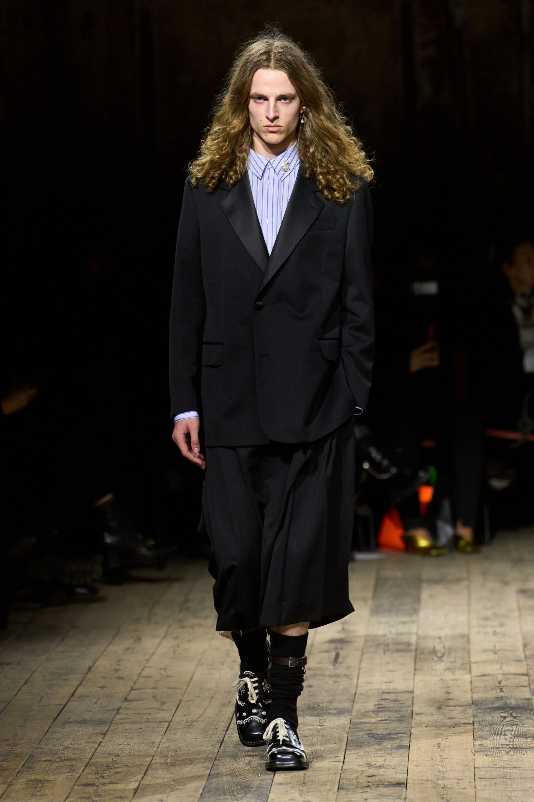 black blazer with pleated skirt