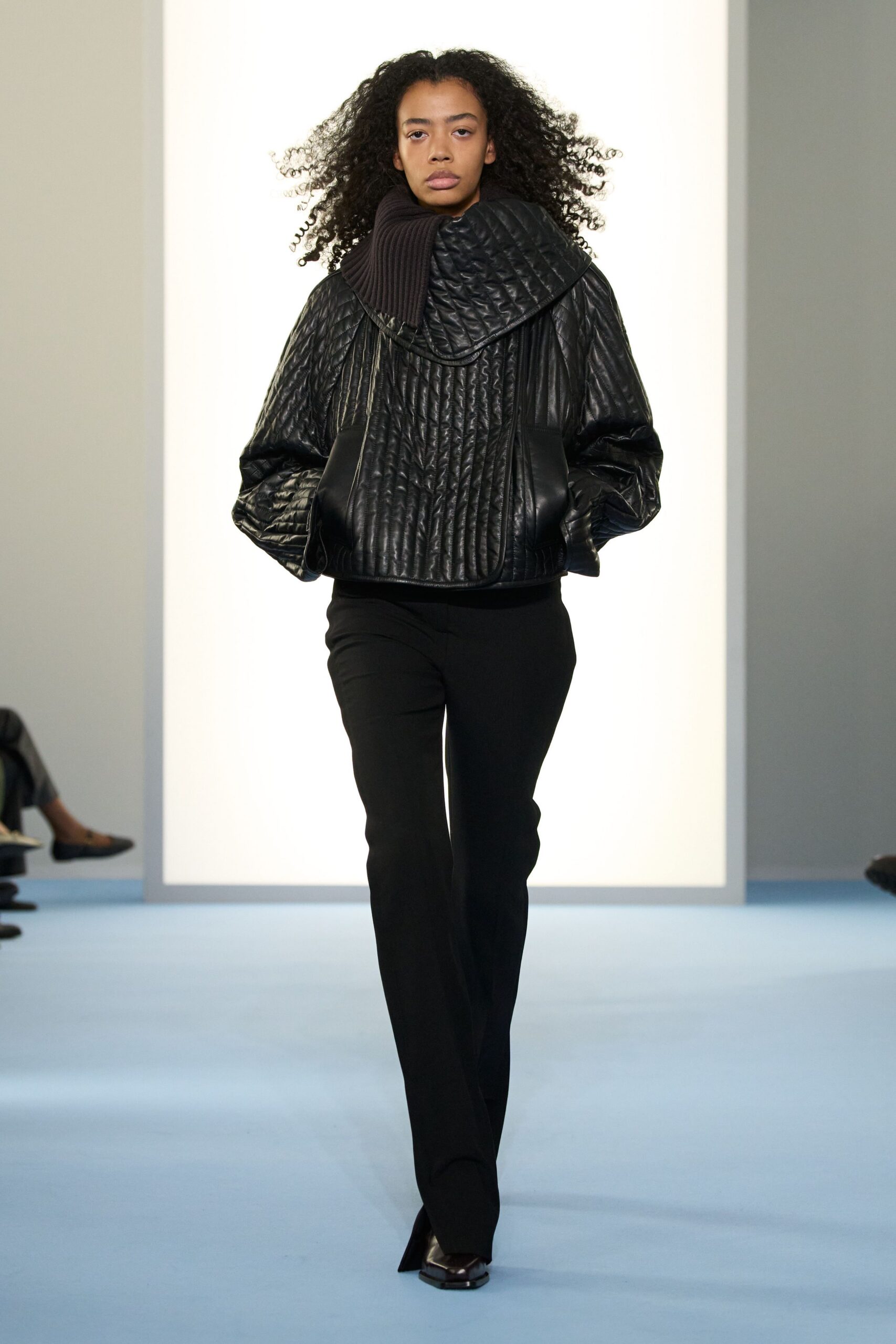 black quilted leather jacket with slim pants