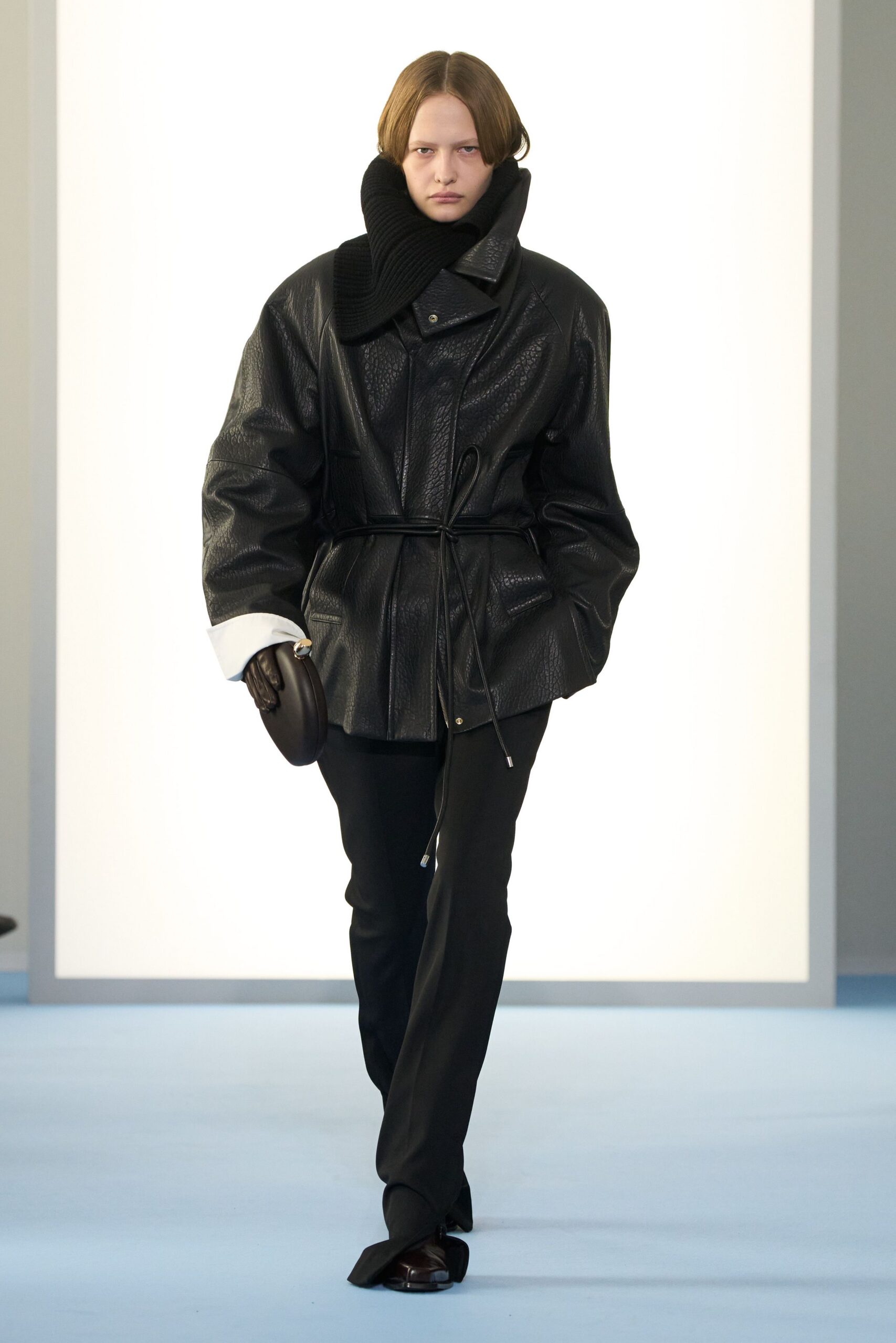 black leather long-sleeve collared relaxed zippered belted jacket