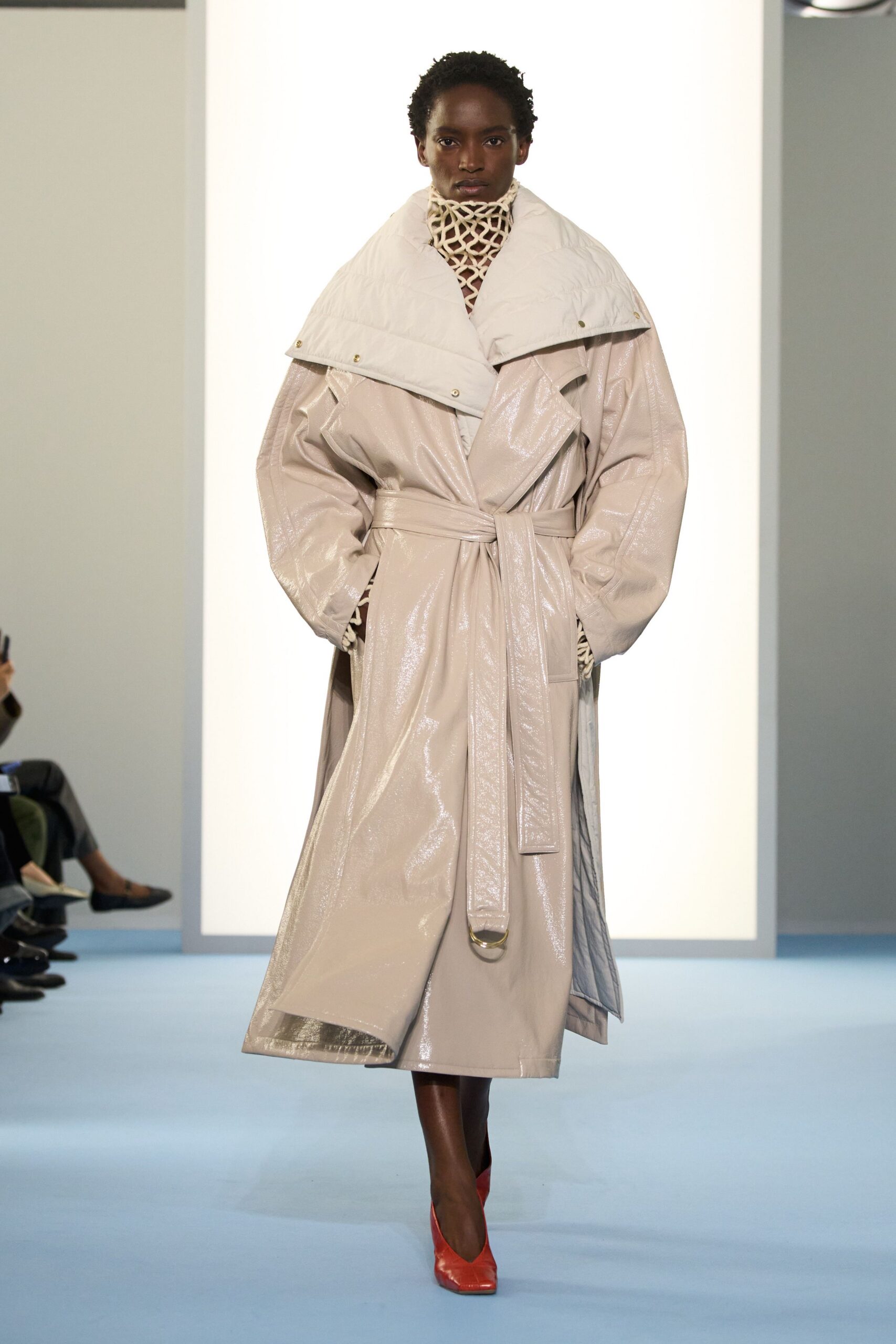 beige vinyl long-sleeve collared oversized belted zippered coat