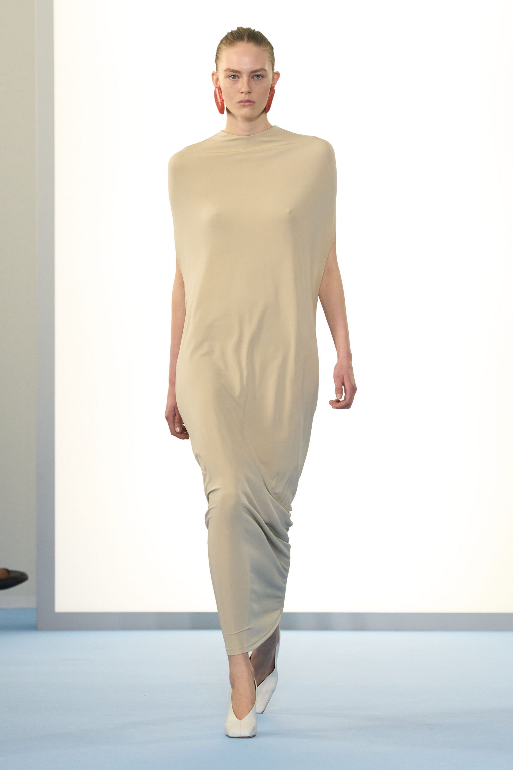beige silk sleeveless high-neck fitted draped flowing gown