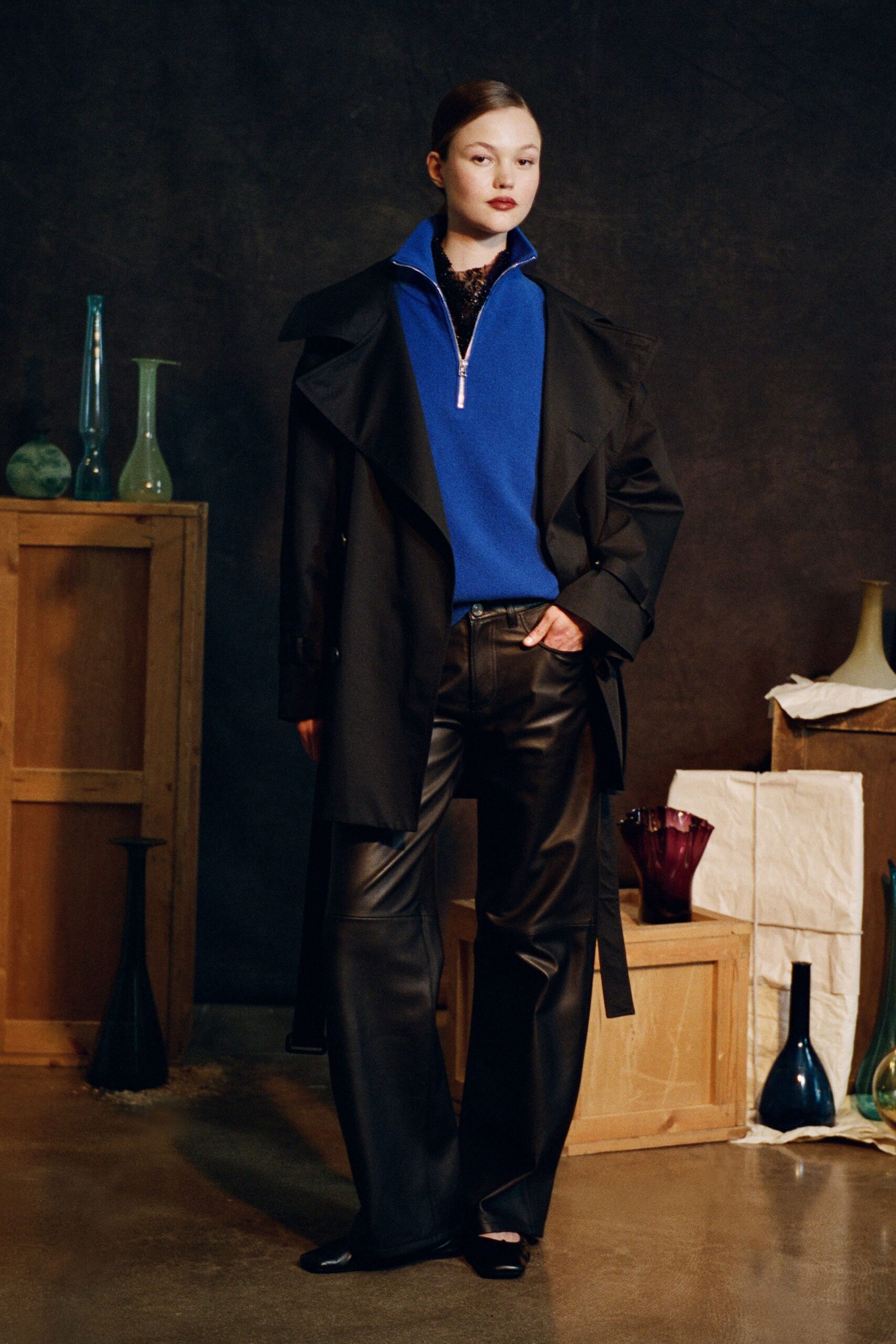 black coat blue top leather pants