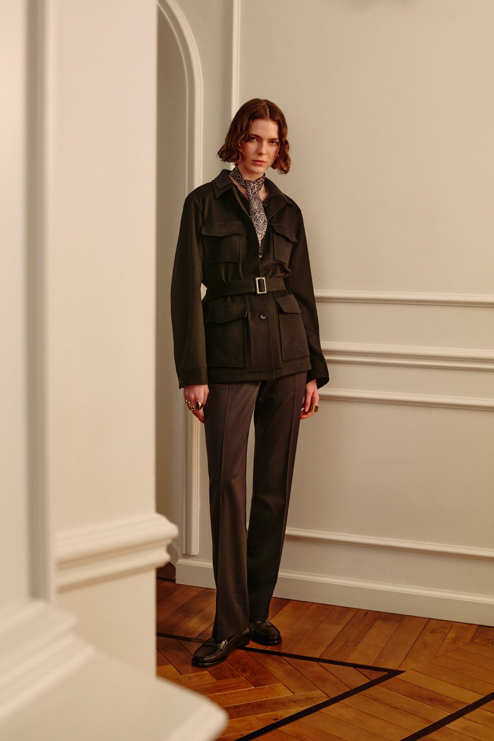 black cotton long-sleeve collared structured buttoned belted jacket