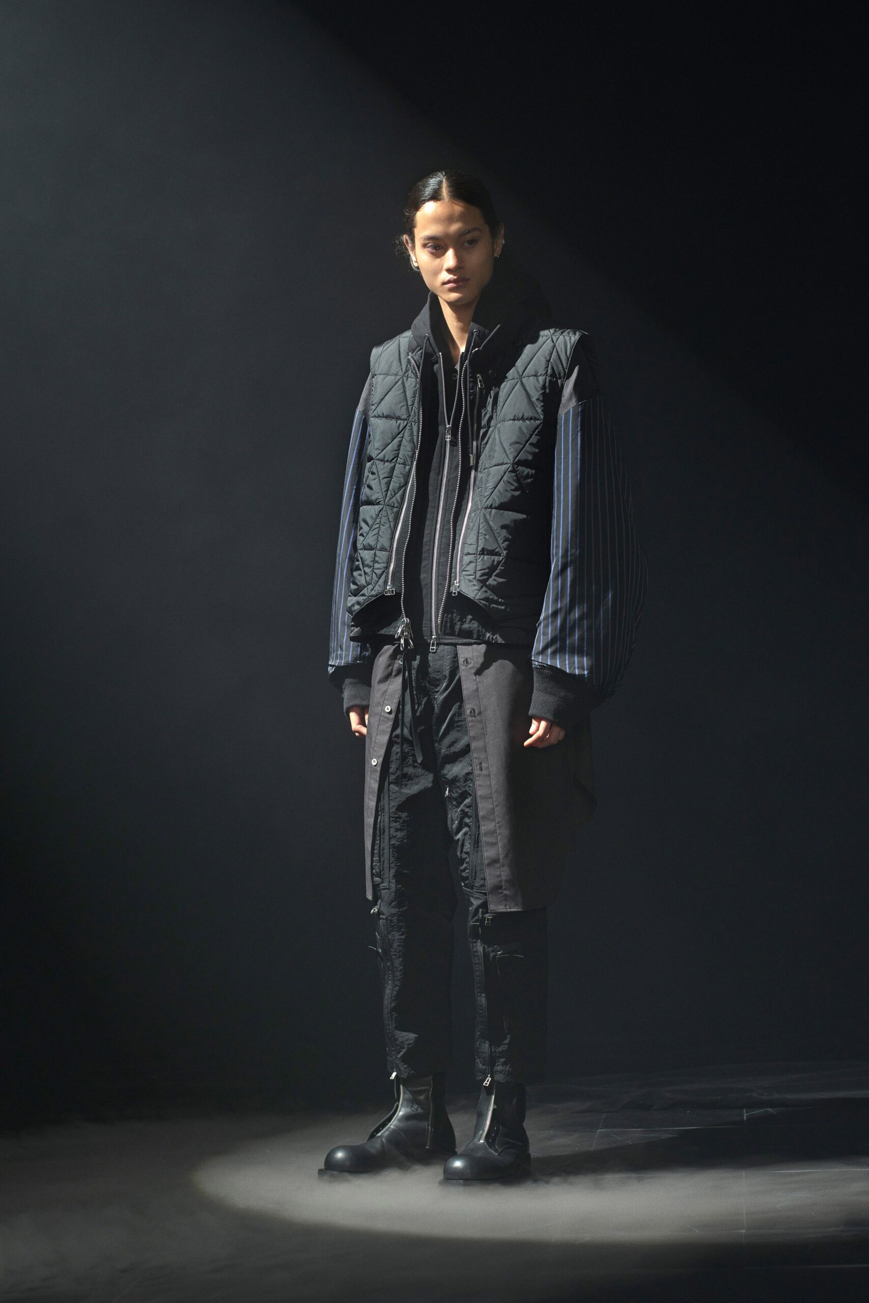black quilted vest and blue striped jacket