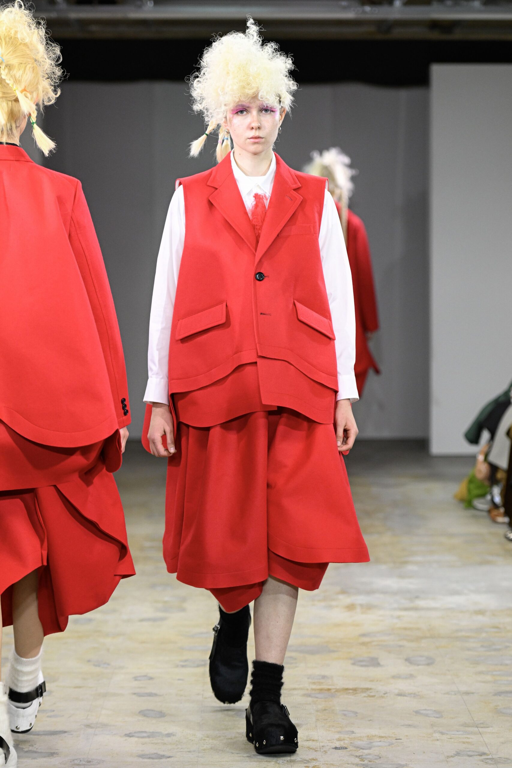 red long-sleeve collared relaxed vest