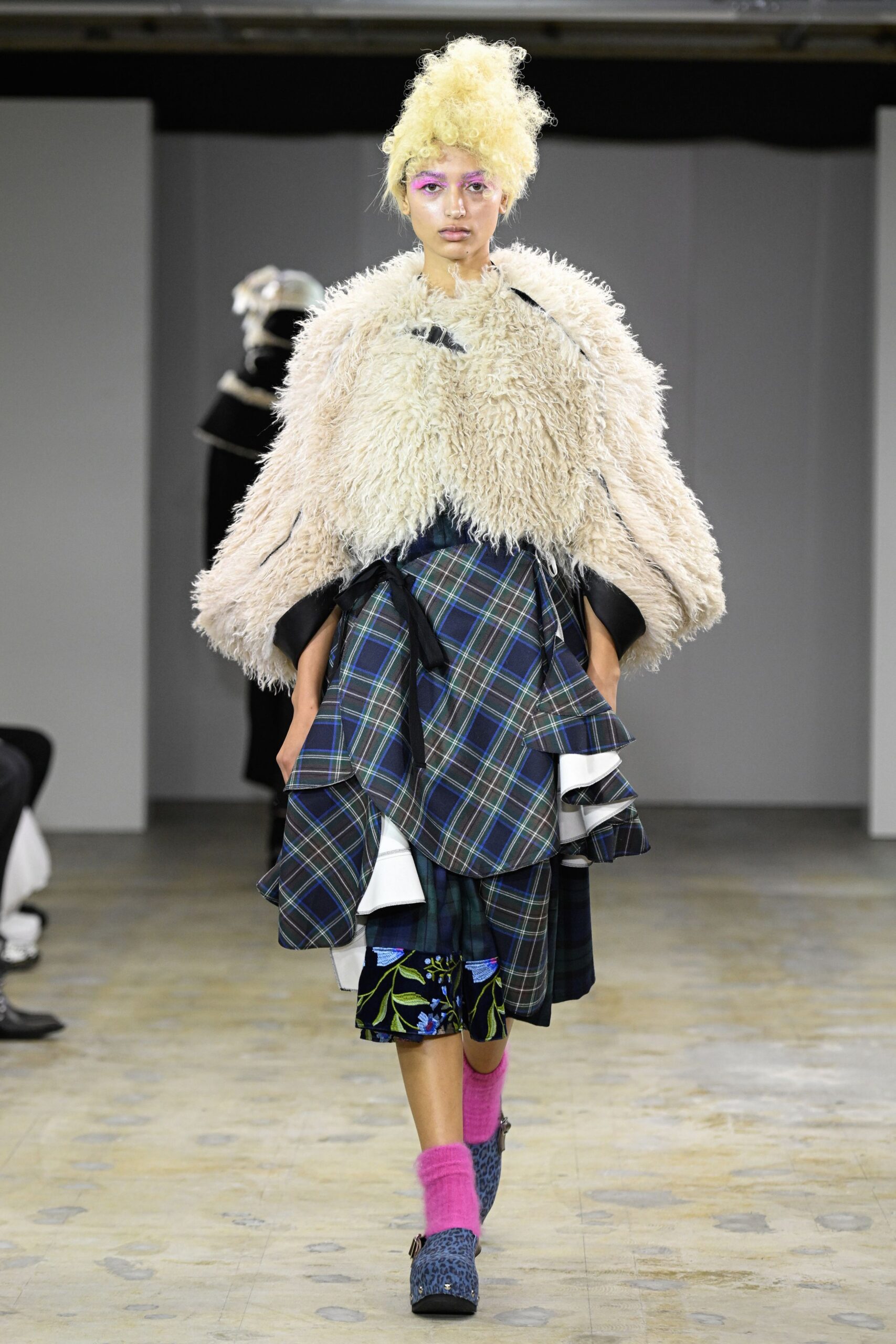 beige faux-fur coat with pleated skirt
