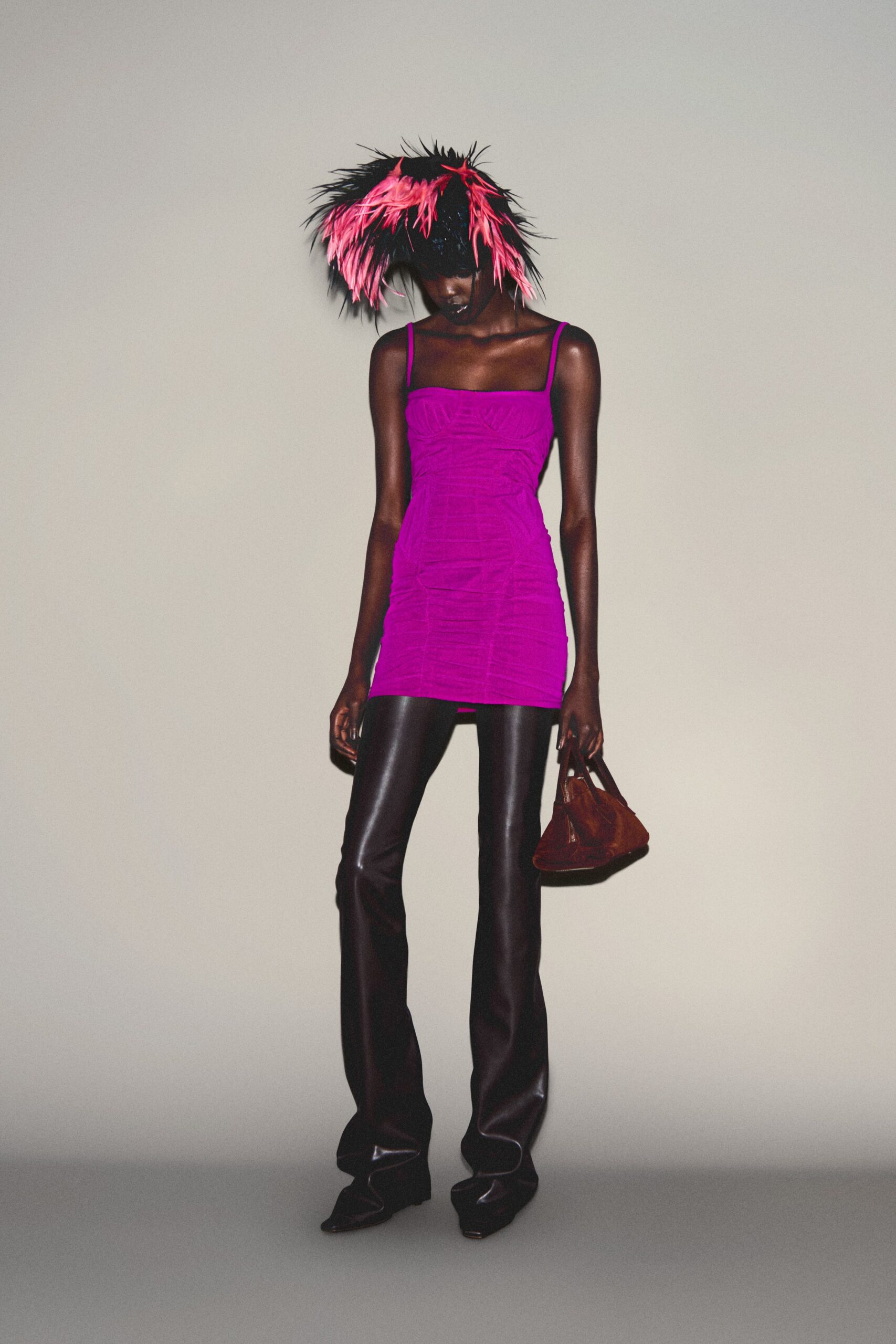 purple fitted top with leather pants