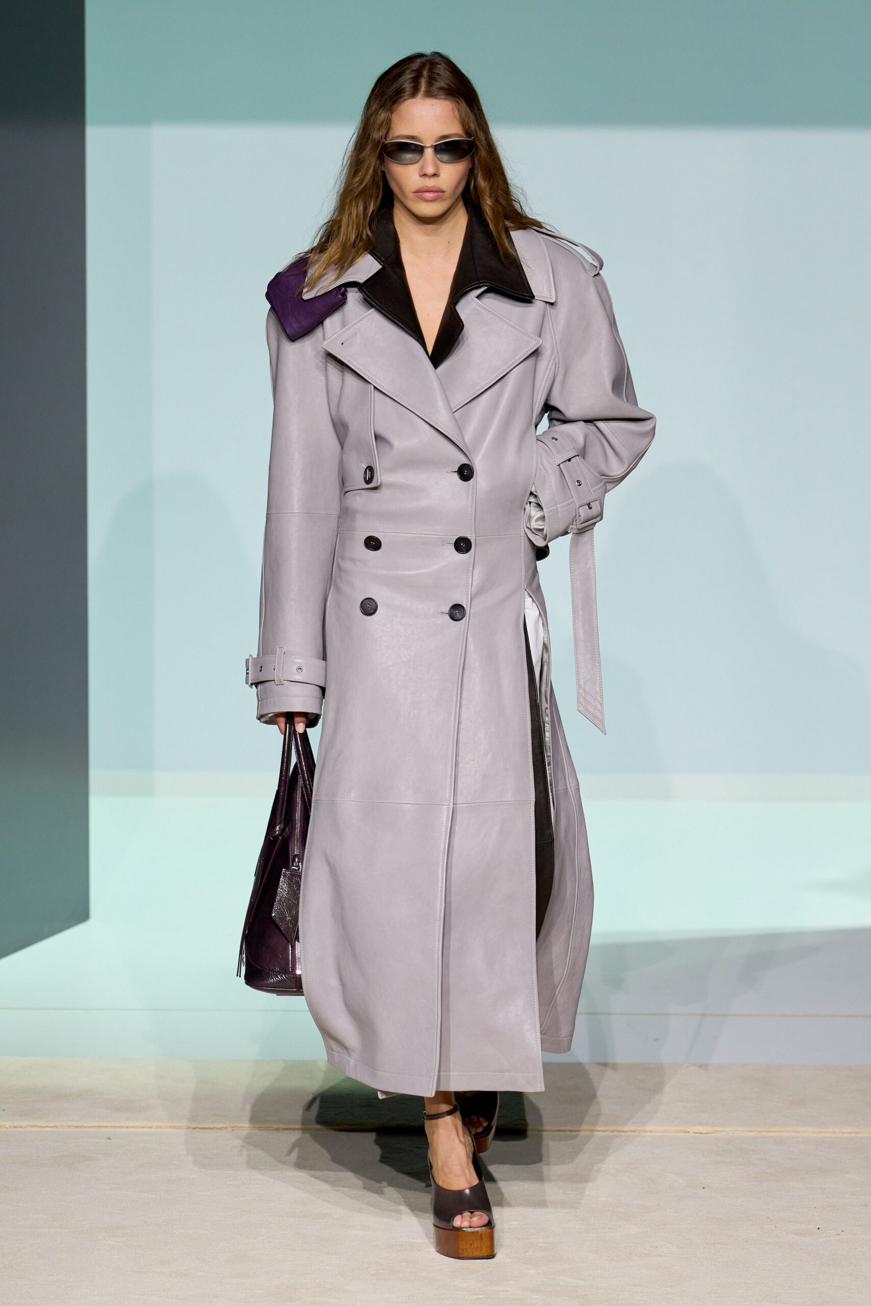 gray leather coat with sunglasses